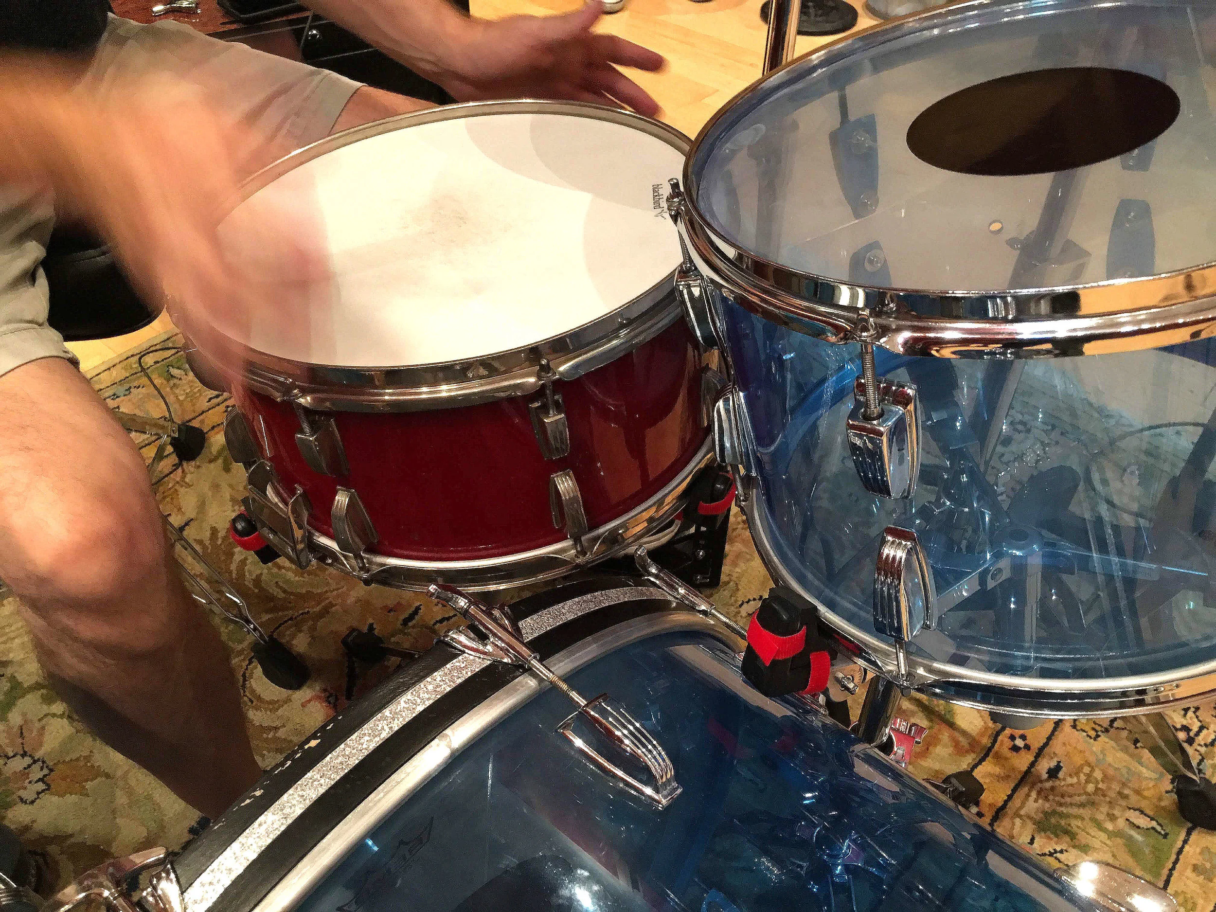 You can see the Booth Shaker mounts velcroed to the snare mounts used to hold the rack tom and snare.