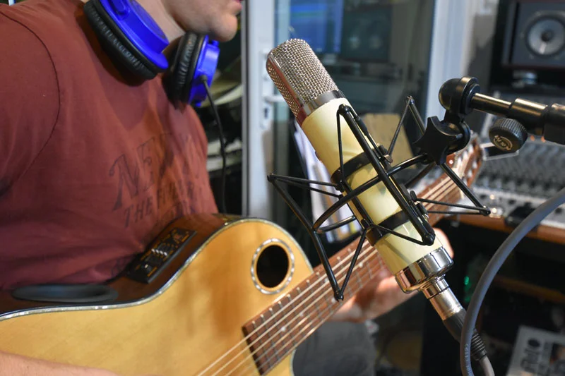 Warm Audio WA-251. Just above the sound hole of the classical guitar.