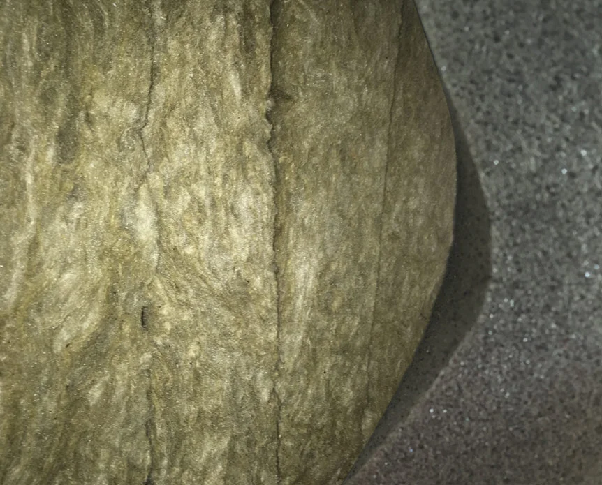 Corner Bass Absorber with foam tile held back to show the rockwool behind