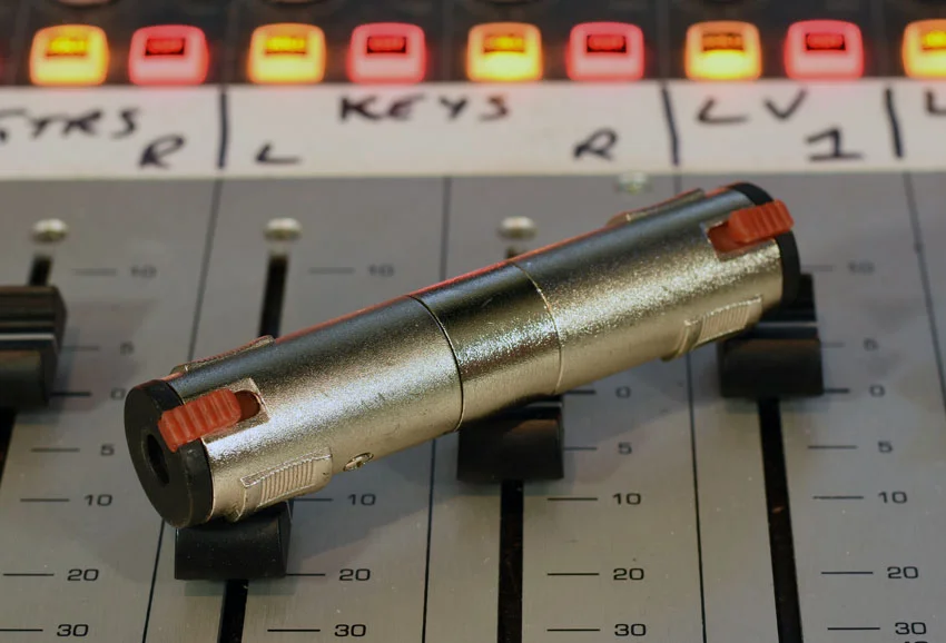 Locking TRS jack to jack connector. Very handy for extending headphone lines.