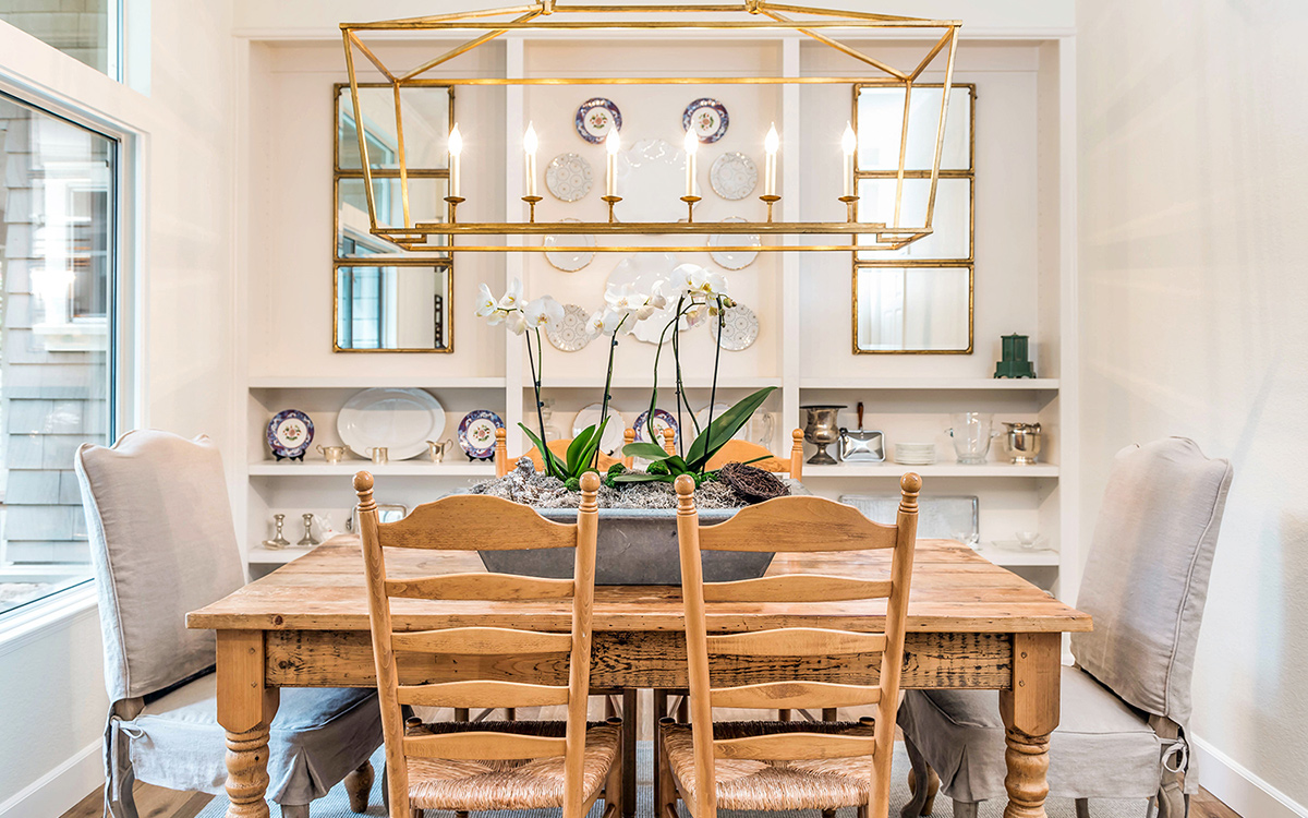 An assortment of new and vintage plates add color and reflection to this dining room.