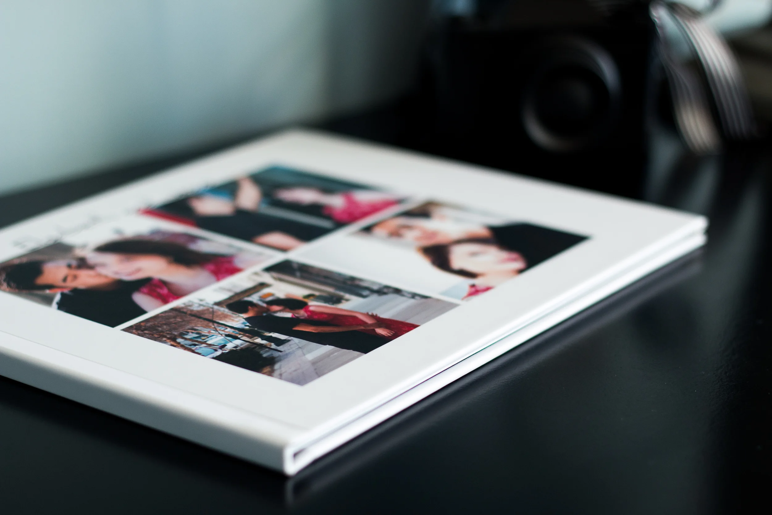 Stacked flat-lay album showcasing full photo spreads.