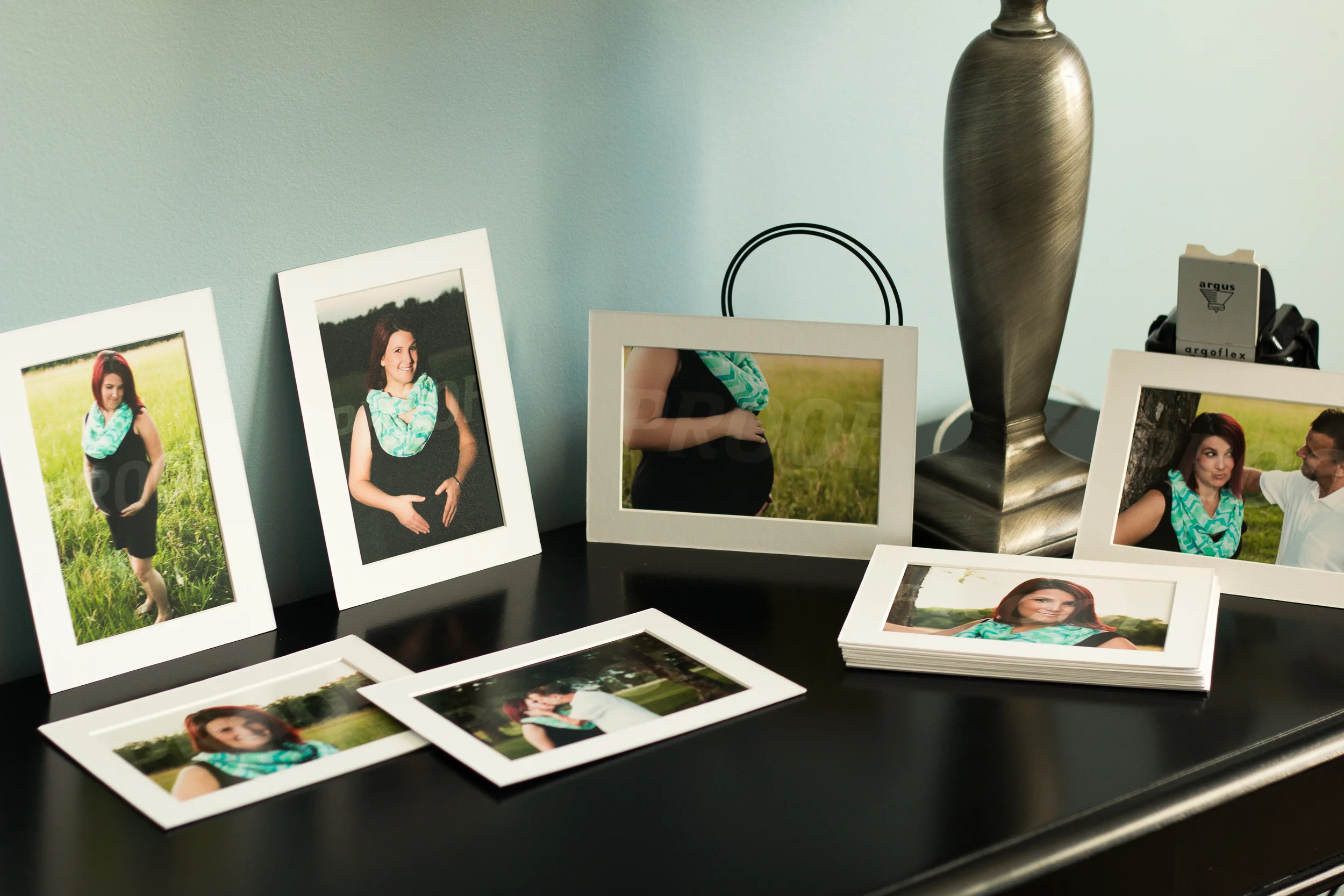 Photo print collection and keepsakes on tabletop display.