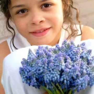 Spring officially arrived yesterday but it really feels like it today. It&rsquo;s a sunny 75 degrees and a welcome reminder that no matter how things may look at the moment each year nature pushes through and begins again. The photo is of my daughter