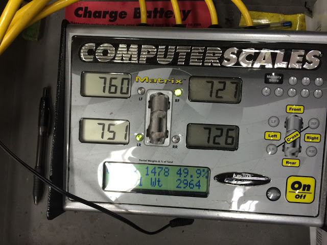 Setting crossweight with 200 pound driver balast in car..jpg