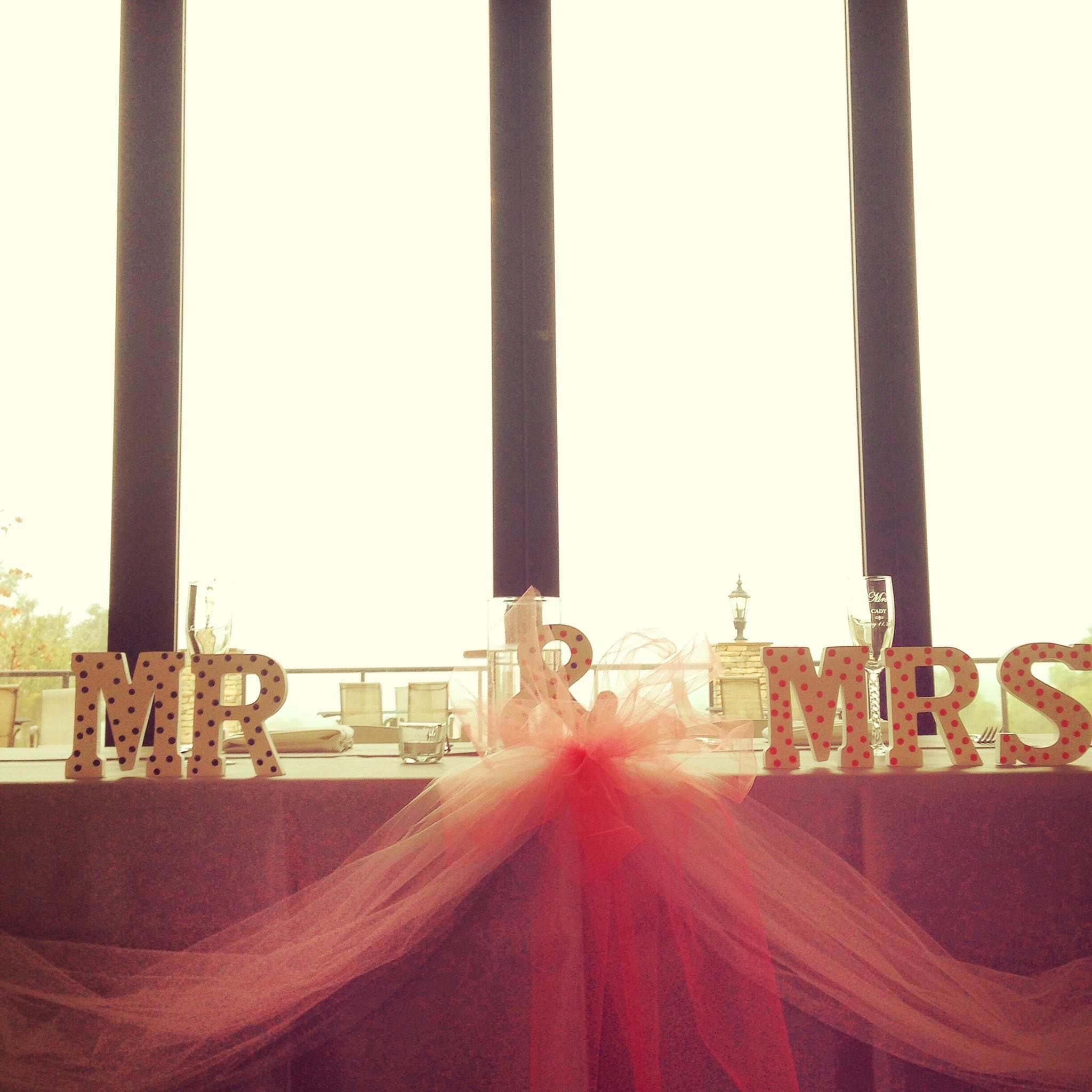 William and Samantha's table decor included a hand painted set of Mr. and Mrs. wooden letters. 
