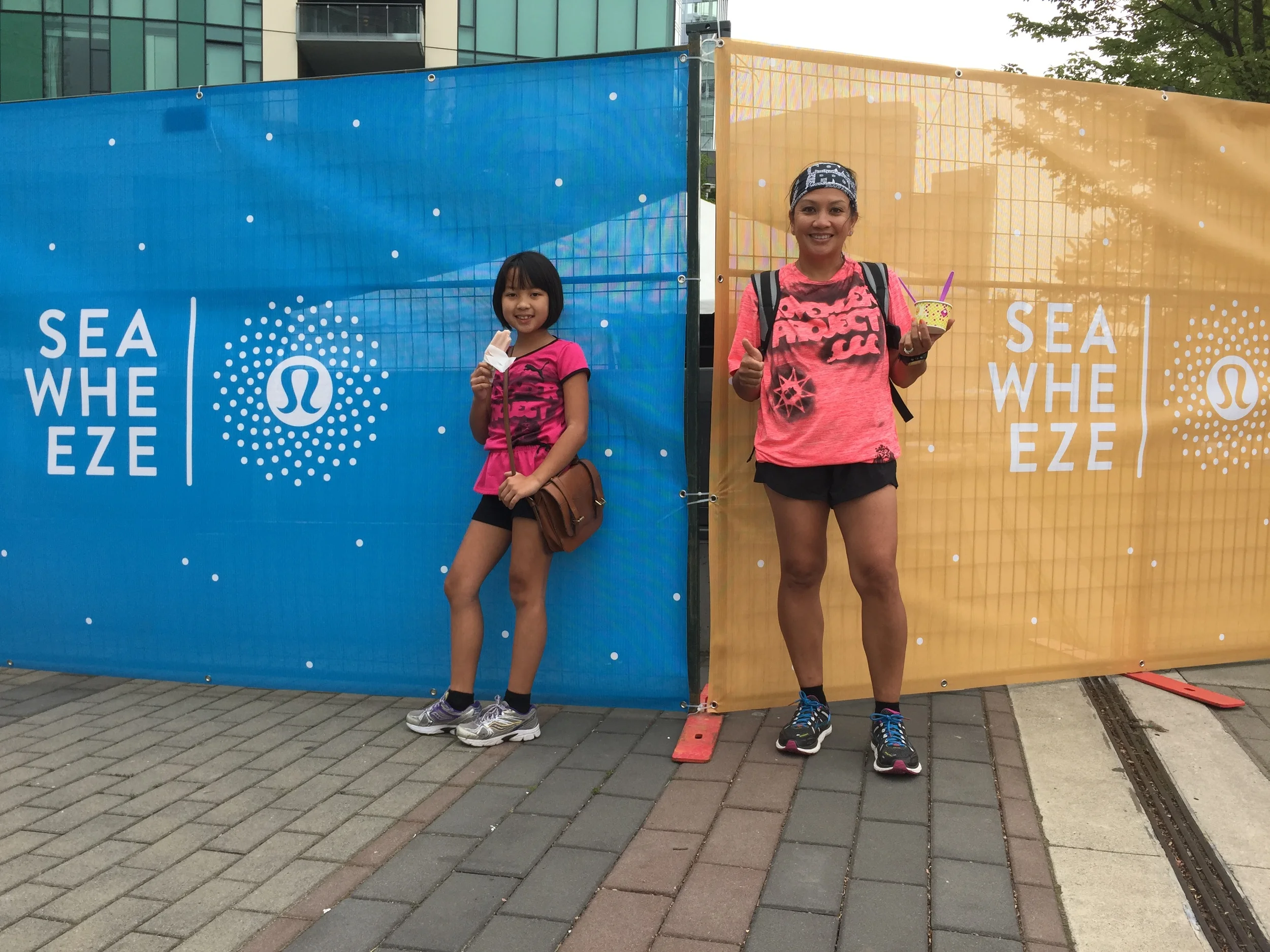 My wife and daughter enjoy frozen treats at the 2015 Seawheeze Half Marathon race expo. 