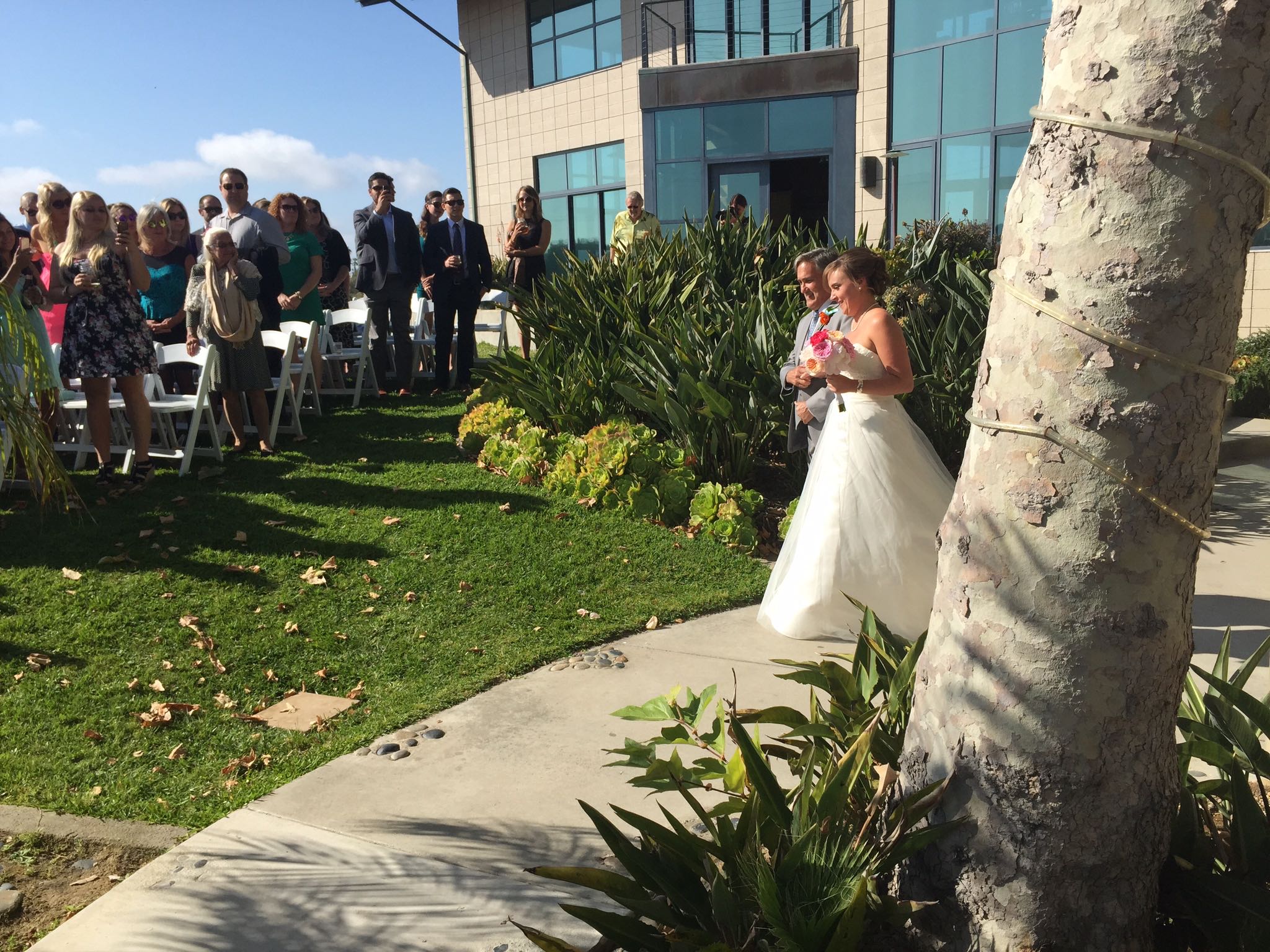 Dad walking daughter down the aisle at Levyland Estates in Carlsbad, California. 