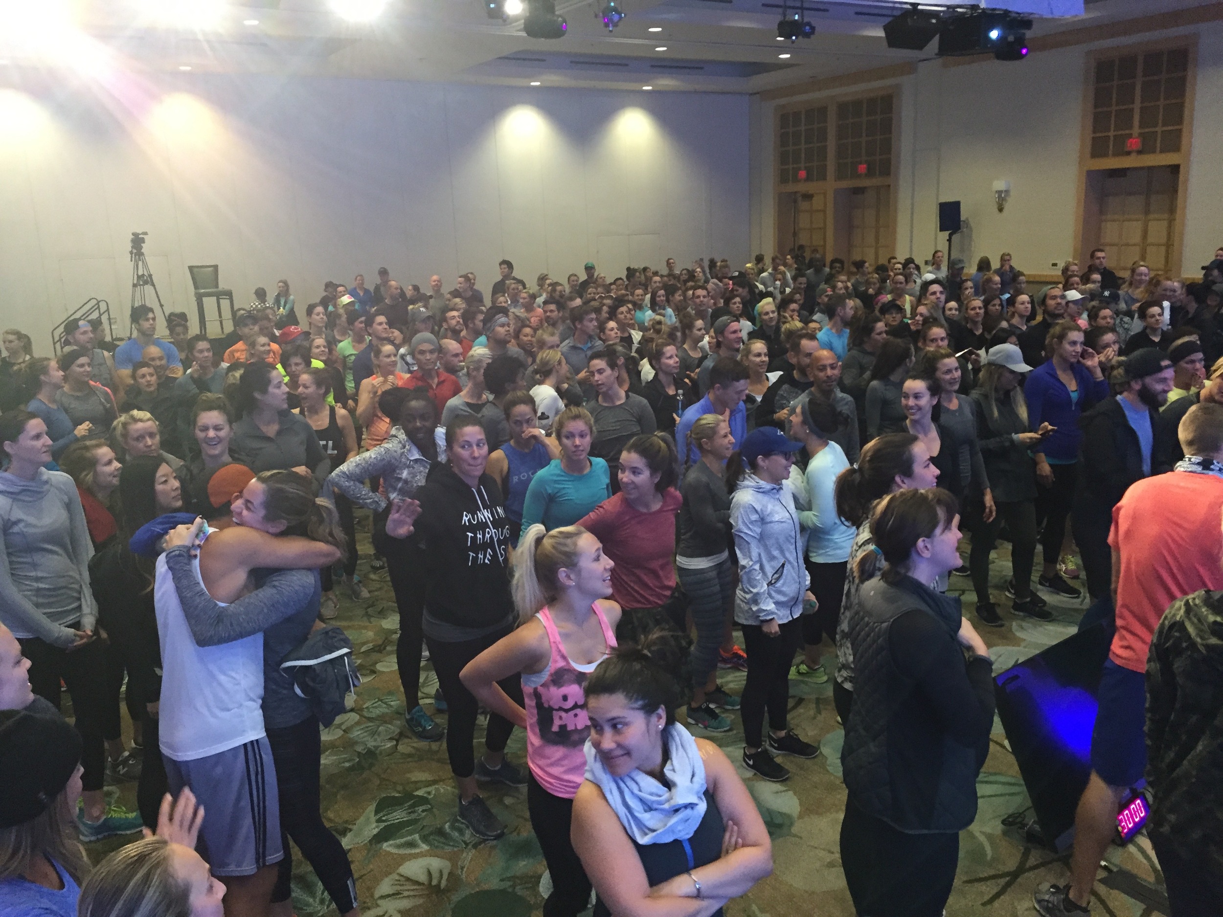 November Project Vancouver and Lululemon leaders listen as workout instructions are given. 