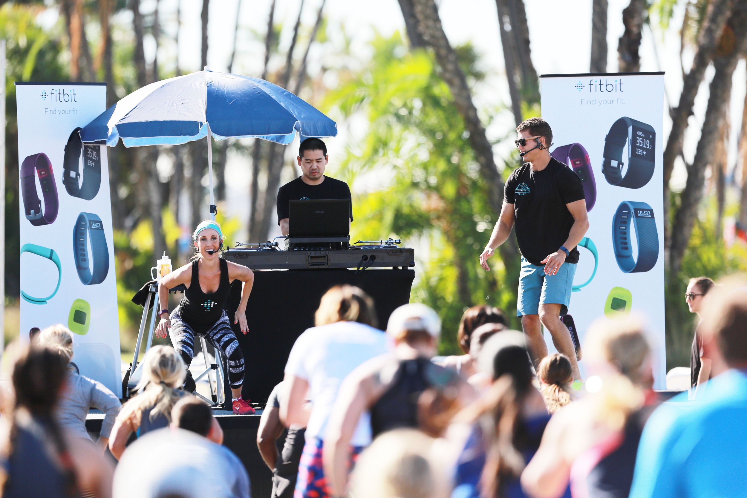 DJ Justin Kanoya on stage with Sheri Matthews and Mike Sherbakov as they kick off the Fitbit Local program in San Diego.