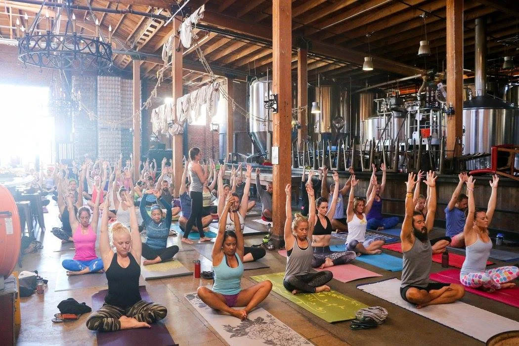 This isn't your typical yoga space. Mission Brewery in downtown San Diego was the venue for a Movember Foundation fundraiser featuring a yoga flow led by Lauren Padula, with live music spun by DJ Justin Kanoya. 