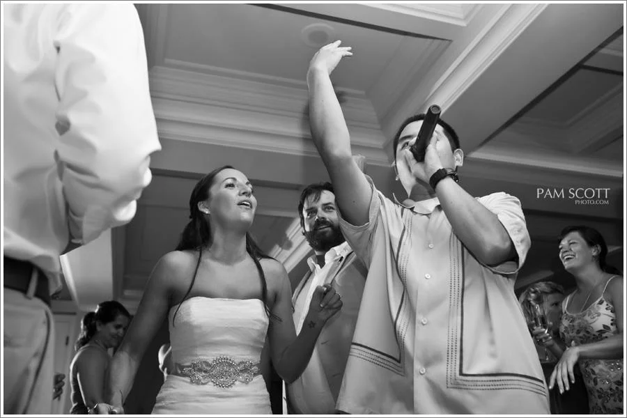 San Diego DJ, Justin Kanoya, gets onto the floor and hypes the crowd up alongside the bride and groom. PHOTO: Pam Scott Photography