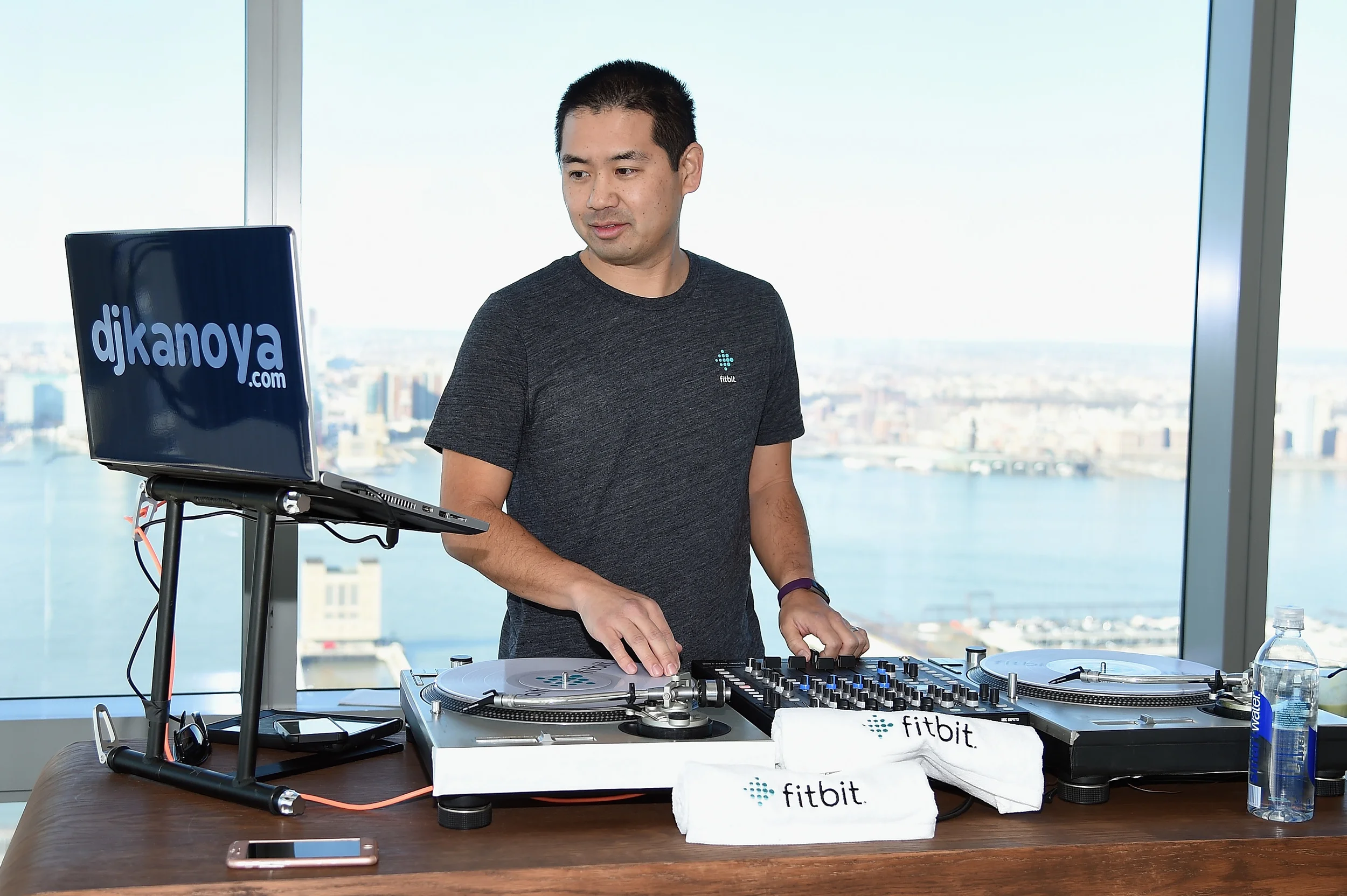San Diego DJ, Justin Kanoya, plays a hip-hop music set for the Fitbit Alta product launch and workout led by Harley Pasternak. 