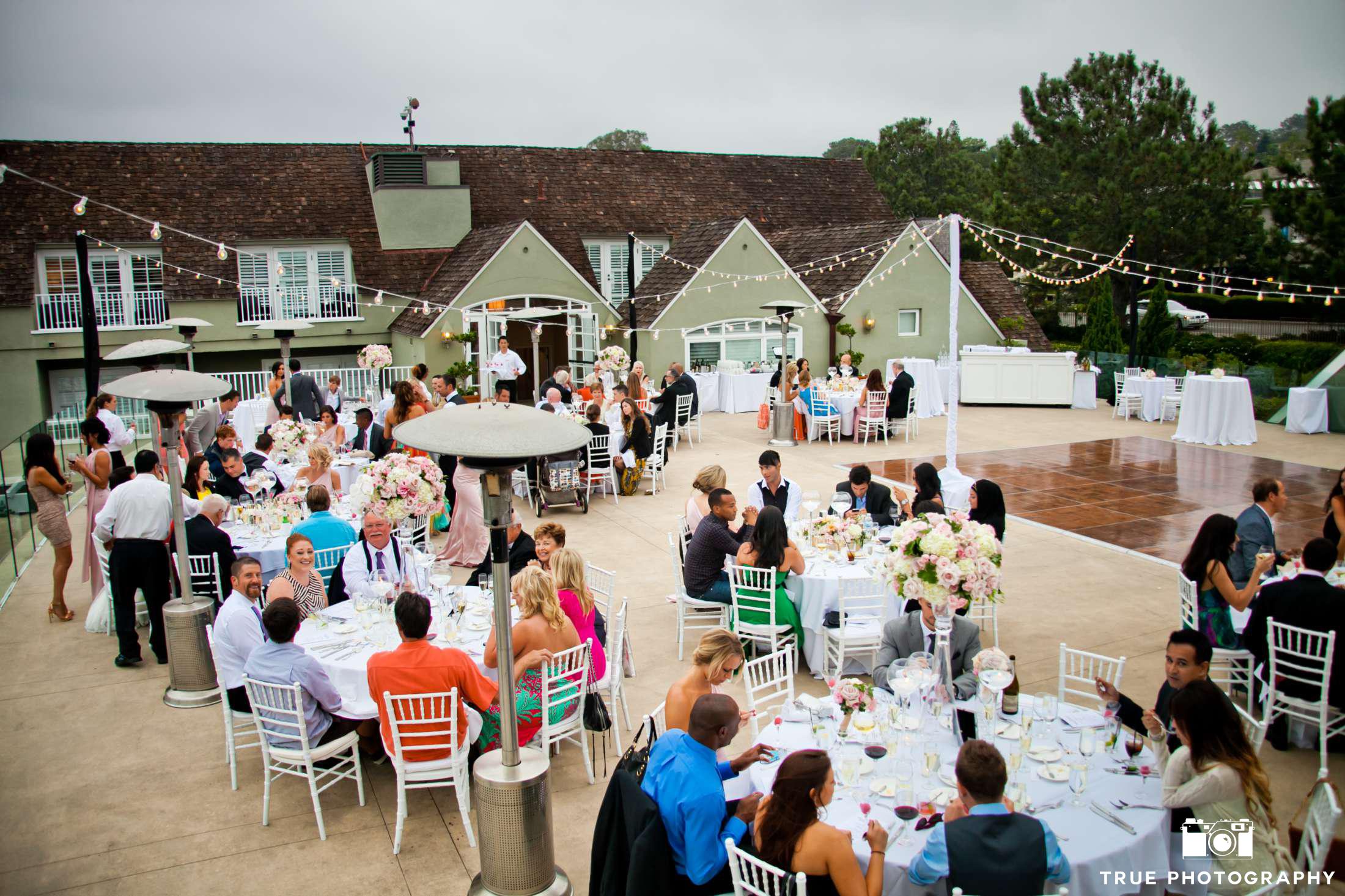 Having the wedding party sitting among the guests is the best of both the sweetheart and head table worlds. 