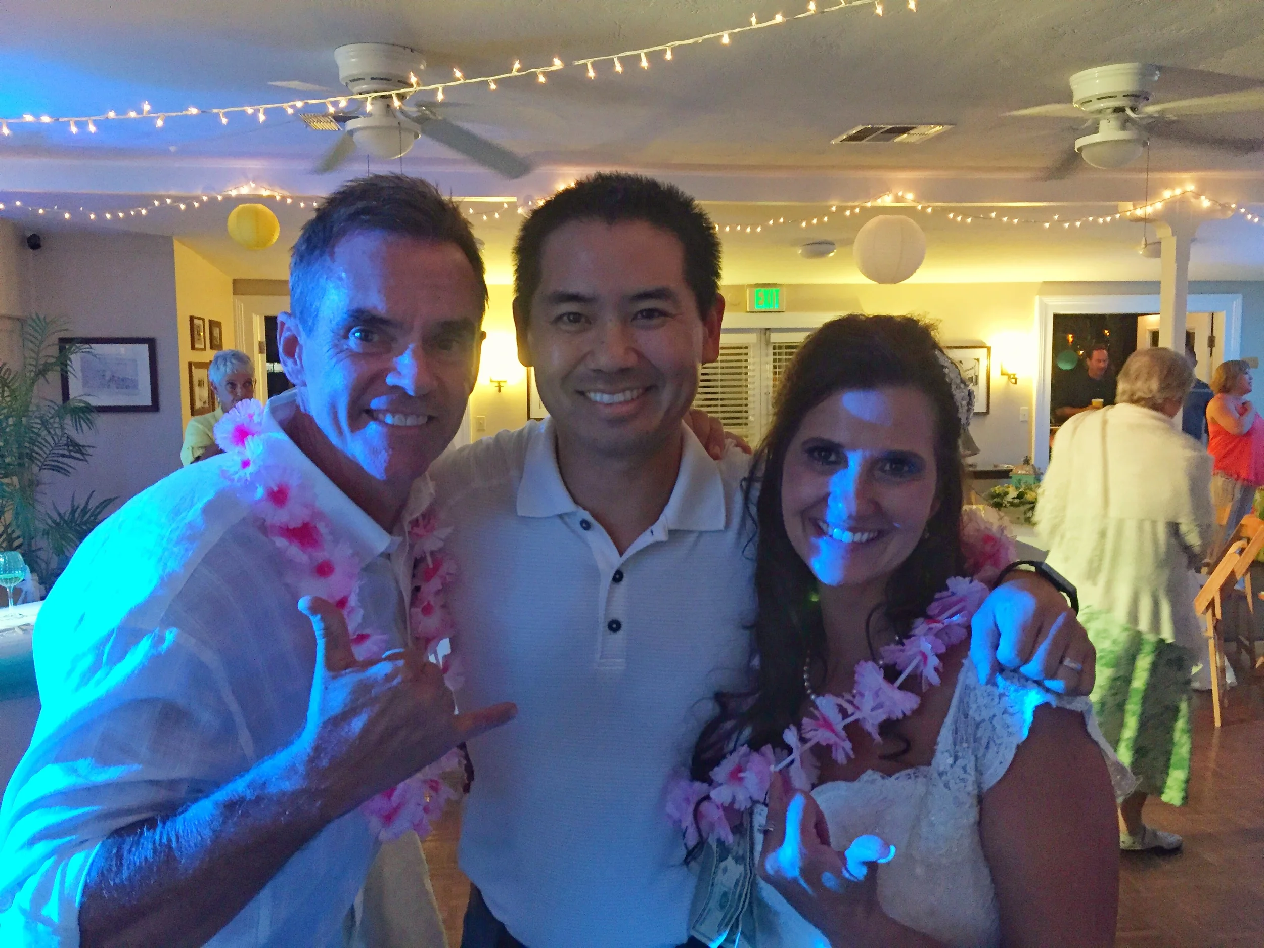 Tim and Gina with San Diego DJ Justin Kanoya at their wedding at the Mission Beach Women's Club. 