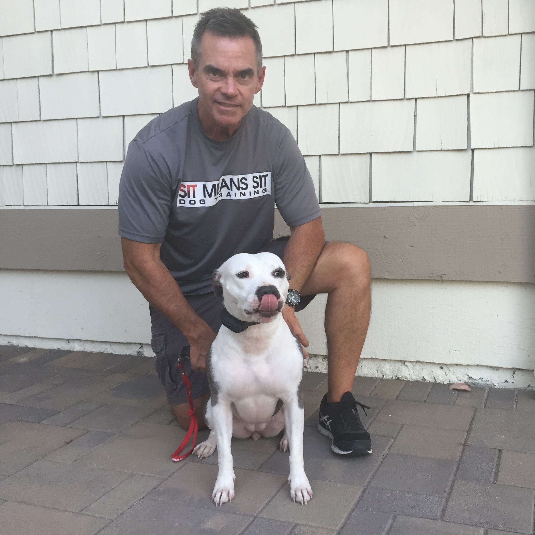 Tim, with my dog Rinny, is a dog behavior specialist with Sit Means Sit Dog Training. 