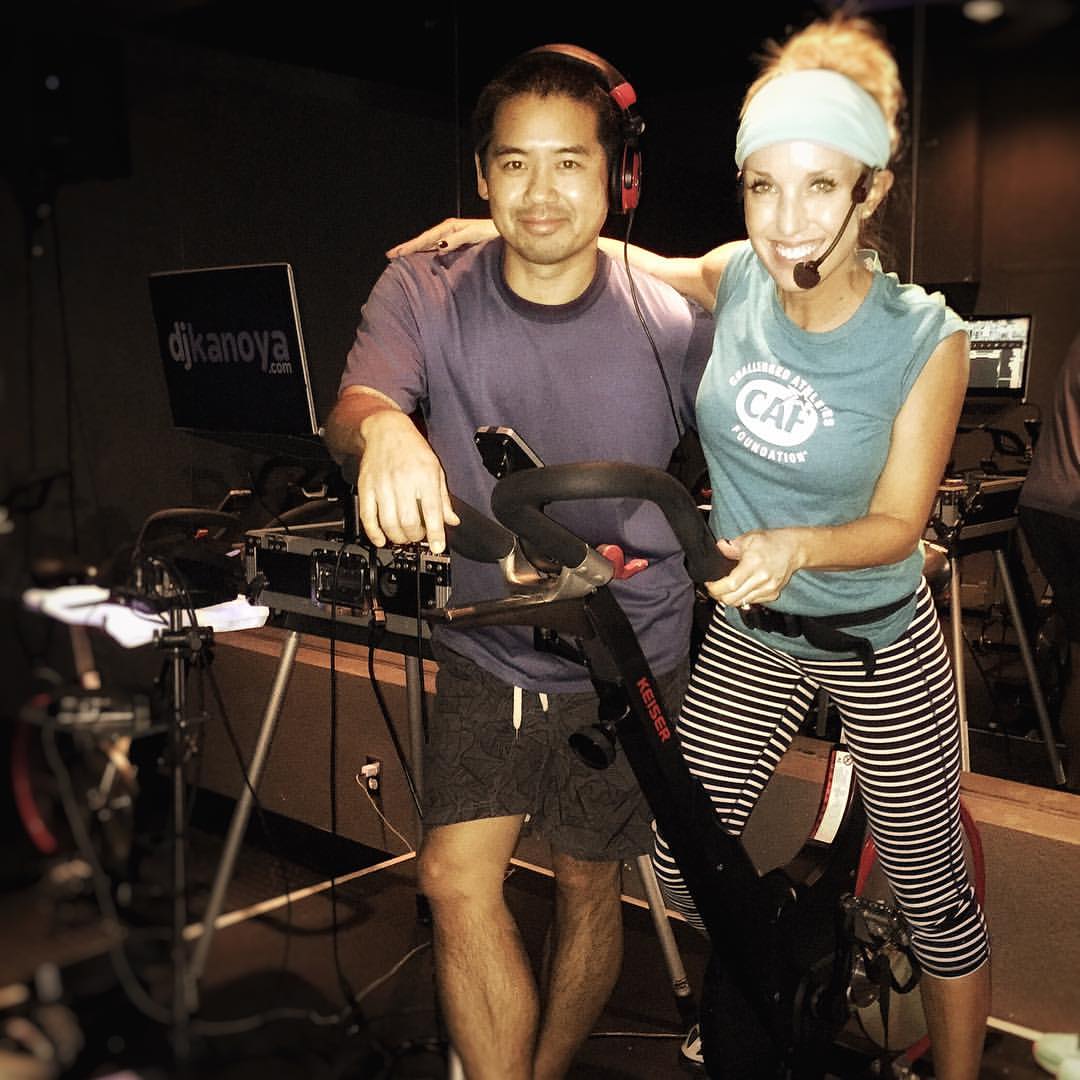 Fitness DJ Justin Kanoya, with corporate wellness professional and spin instructor, Sheri Matthews.