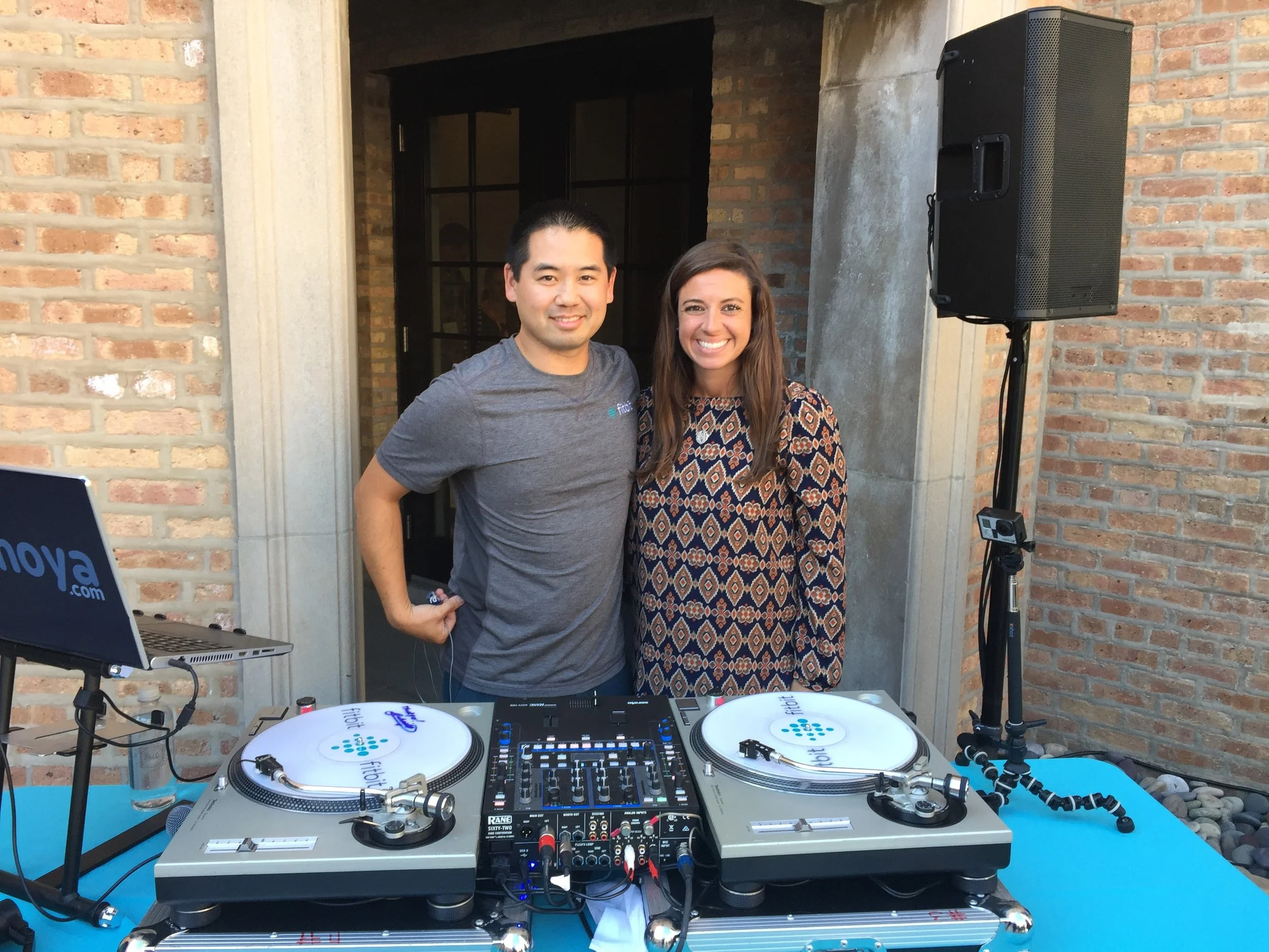 DJ Justin Kanoya, with Fitbit Health Solutions Senior Event Marketing Manager, Andrea Conti.