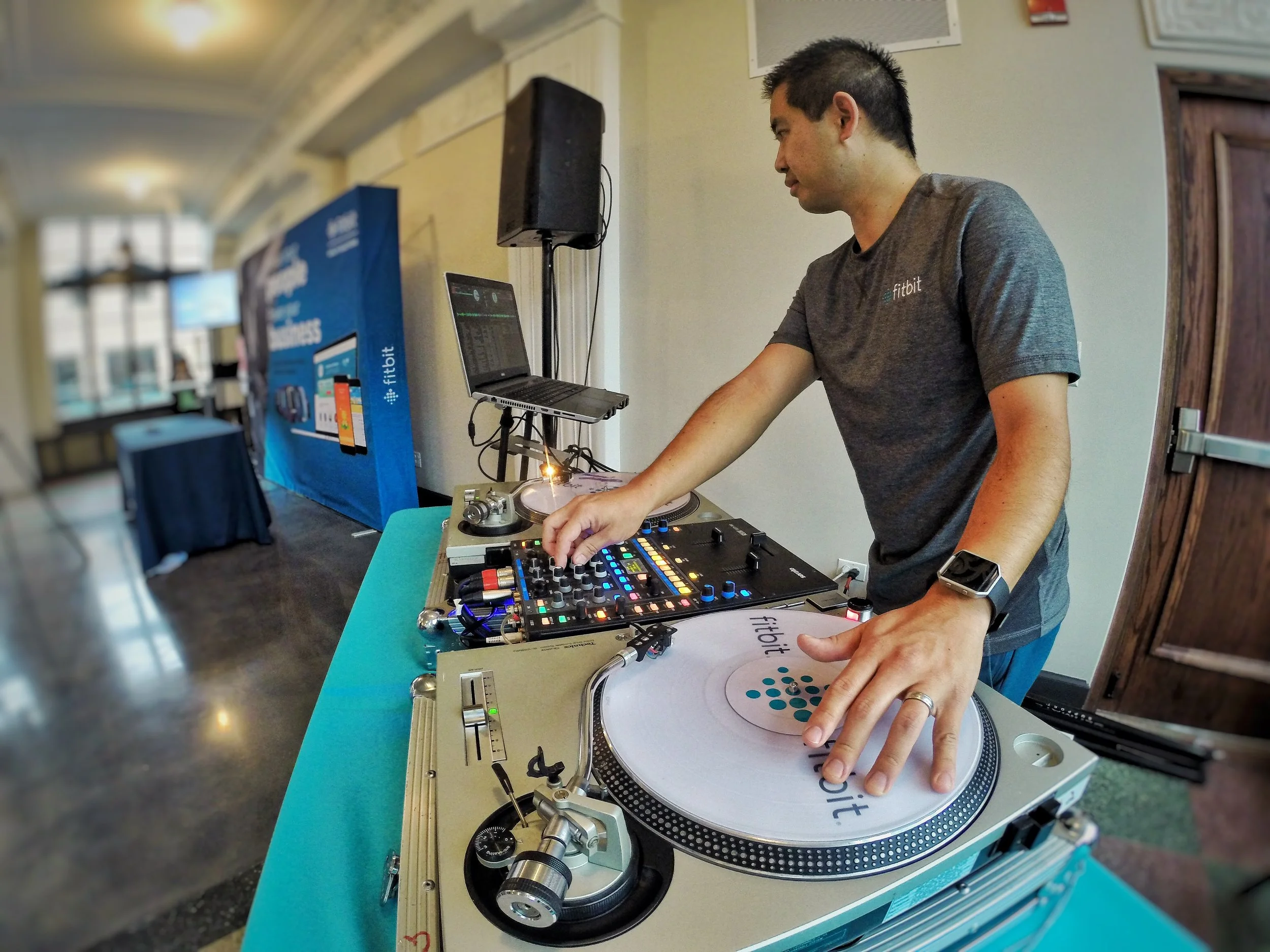 DJ Justin Kanoya, spins music at the Fitbit Captivate conference in Chicago.