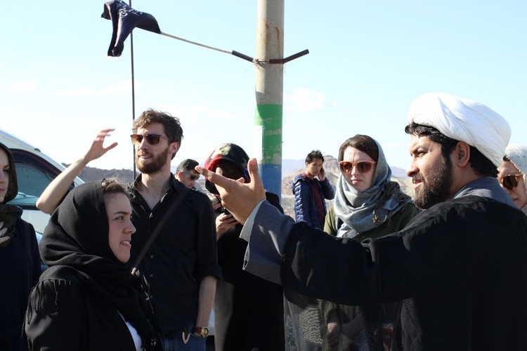 Hojatoleslam Risheri introduces the holy city of Qom to delegates during the Cultural Heritage Symposium. Qom, Iran, March 2016