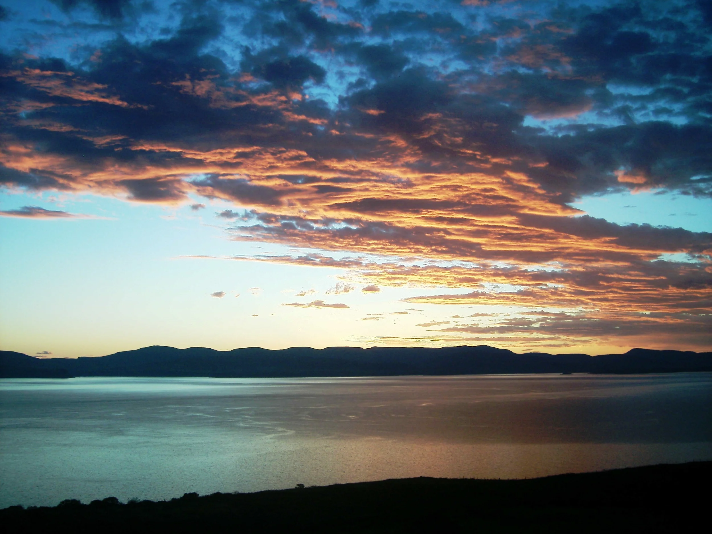 view at sunrise across sea from house.JPG