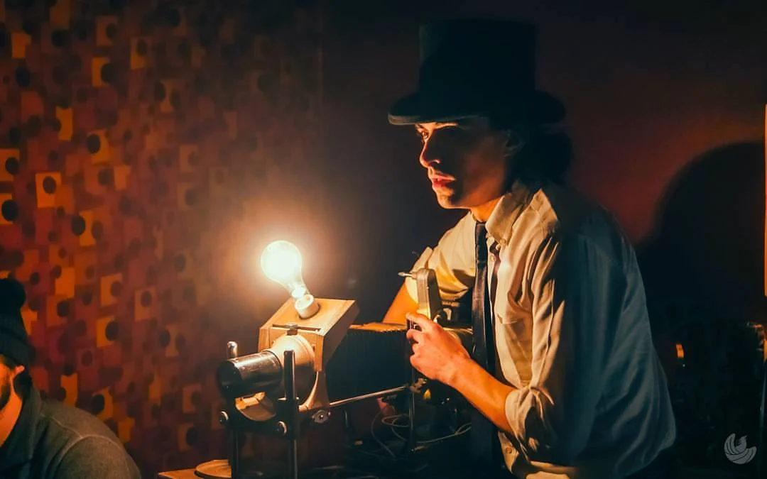 George (Harry Aspinwall) powers on his custom nuclear-powered projector in CRANIAC! (Auspicious Phoenix Productions)