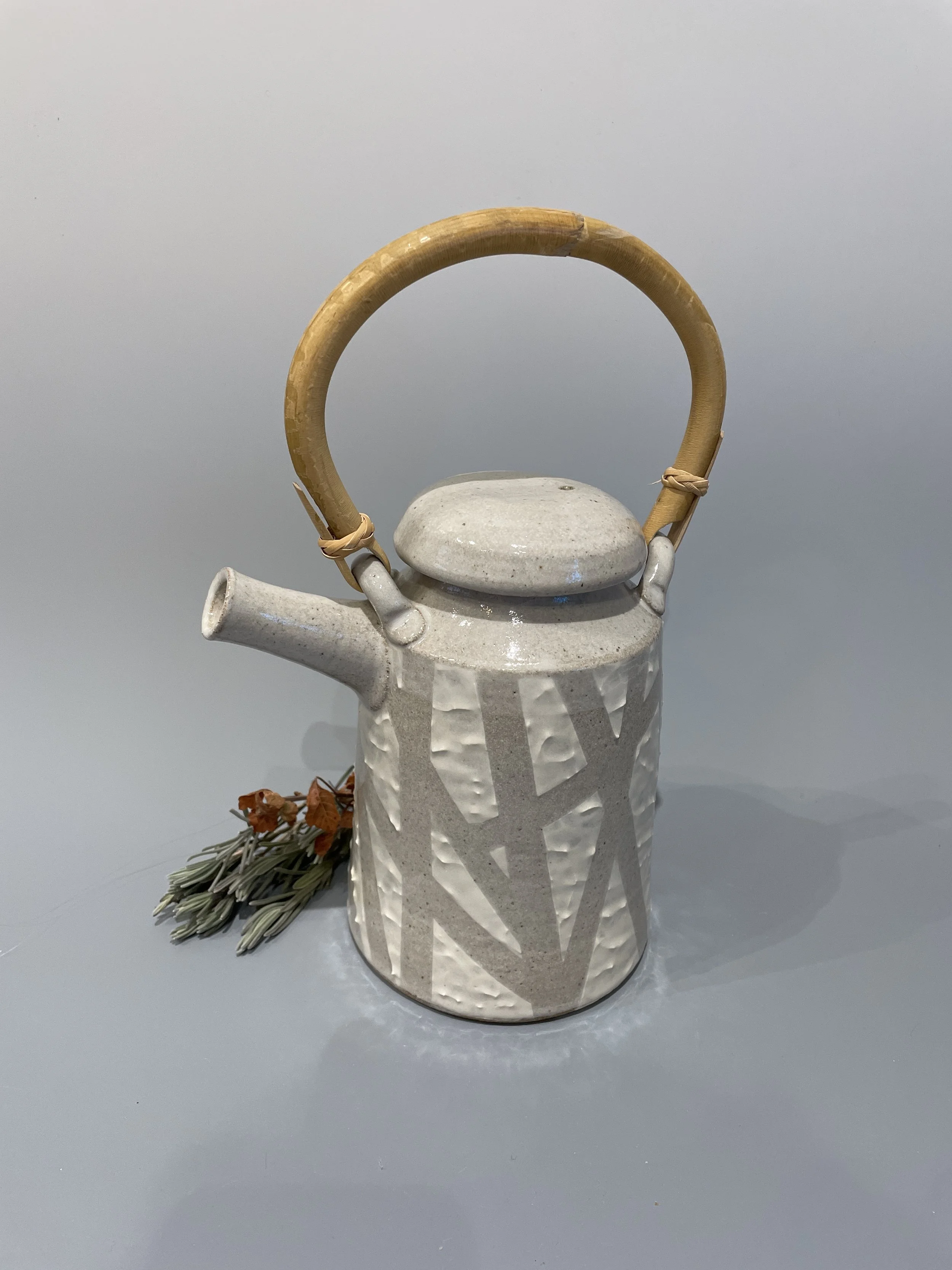 TEAPOT WITH CANE HANDLE