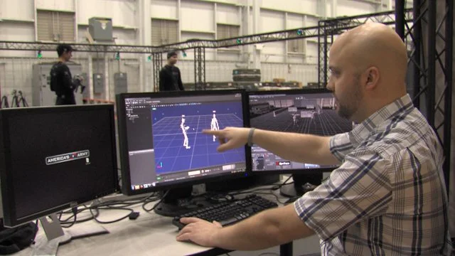 Former-U.S.-Army-Soldiers-Matt-Roberts-and-Ben-Day-along-with-Lead-Animator-Steve-Ross-are-suited-up-at-the-Army-Game-Studio.jpg