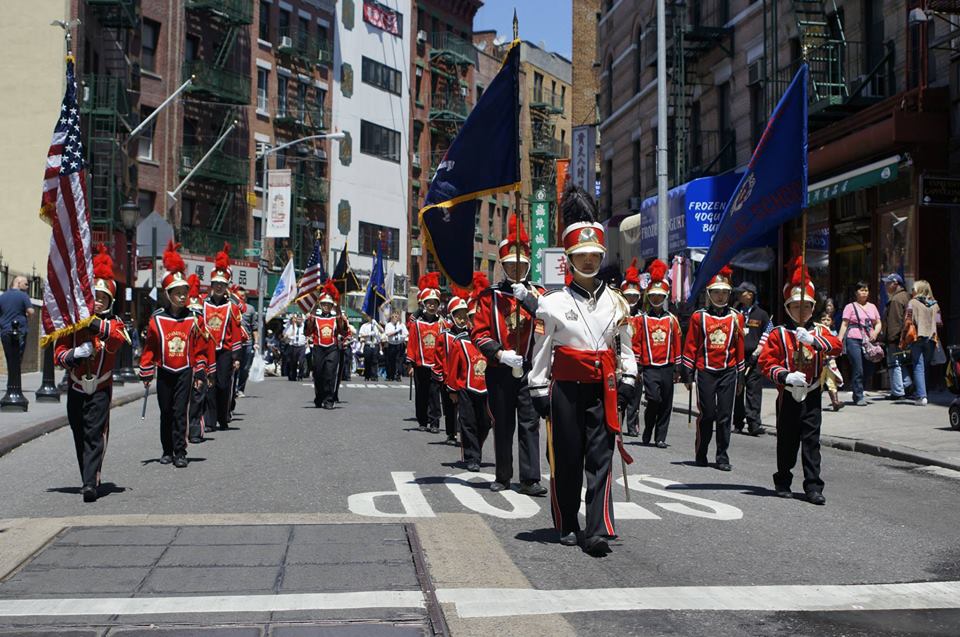 Marching down Mott Street in New York Chinatown