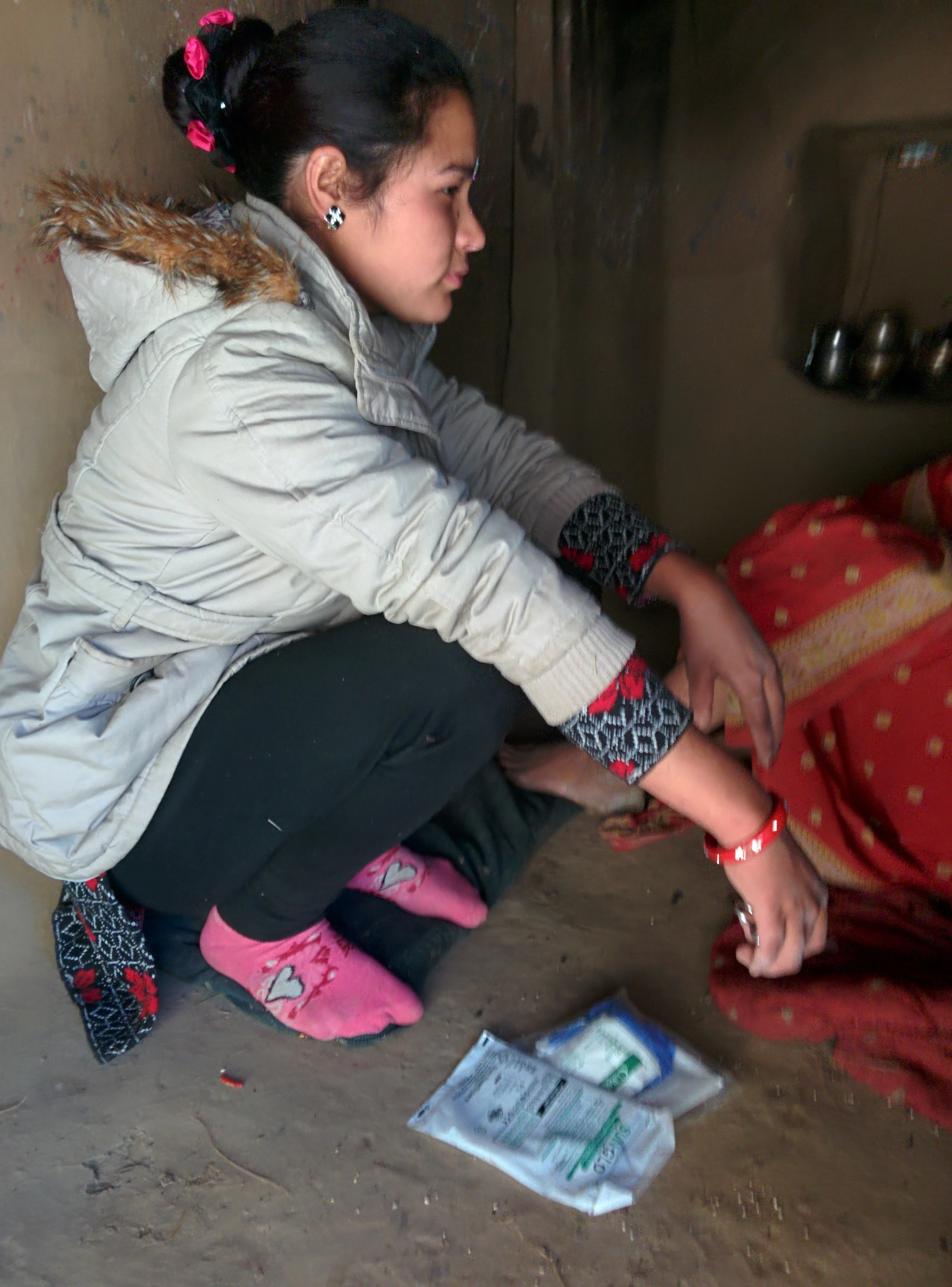 One of community health workers Sarita Singh making a home visit with a hygienic birth kit.