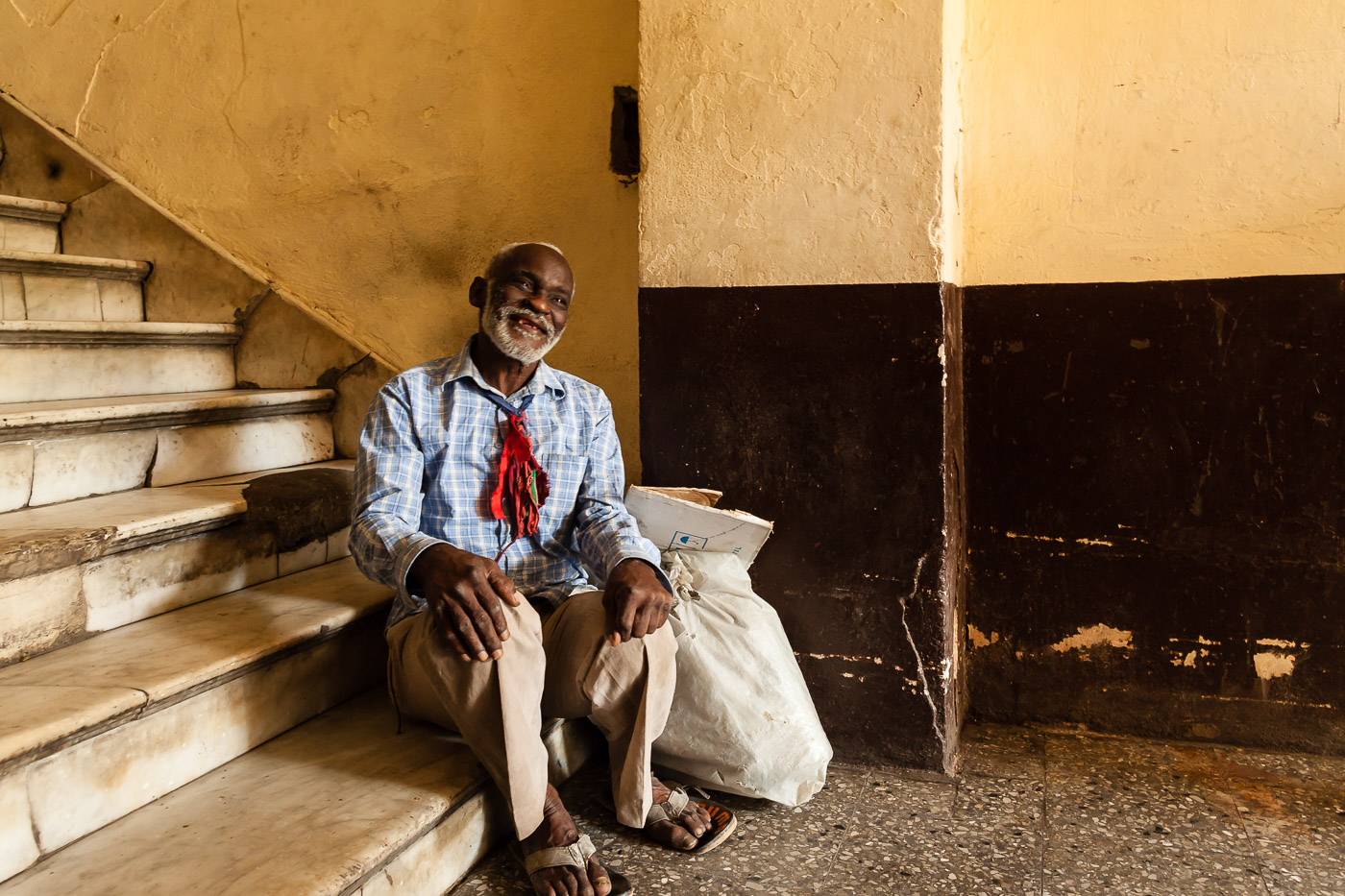 Cuban Man Resting on the Steps