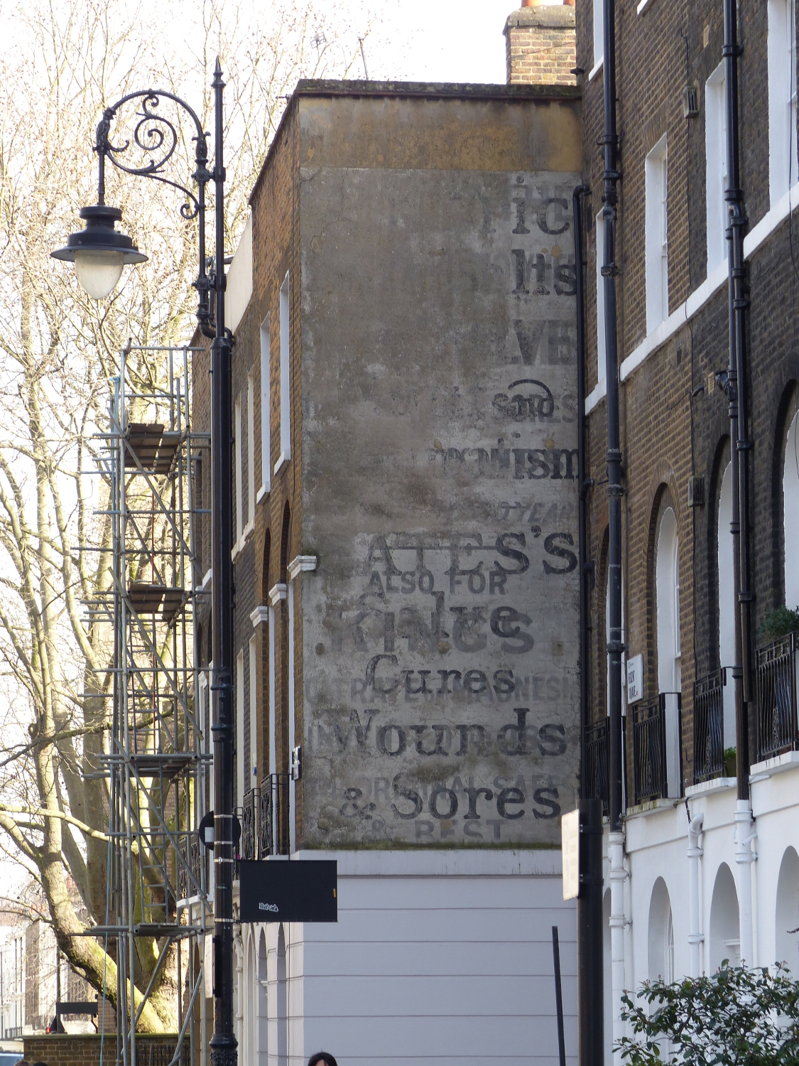 Old outdoor ad, Bloomsbury, London.