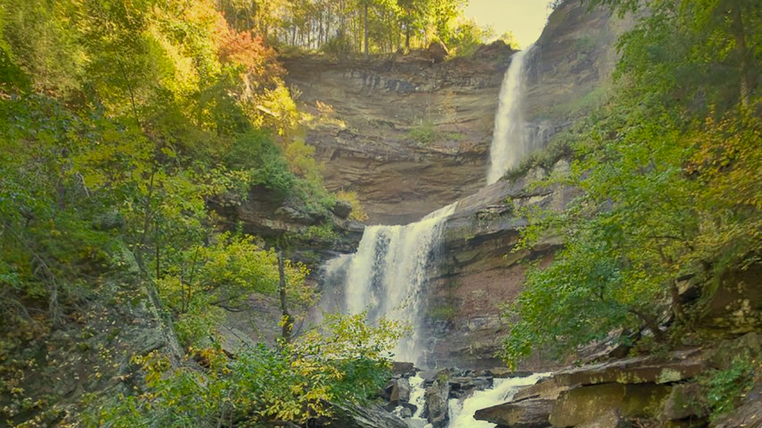 Kaaterskill Falls in Haines Falls, NY. Double tiered waterfall in fall colors.