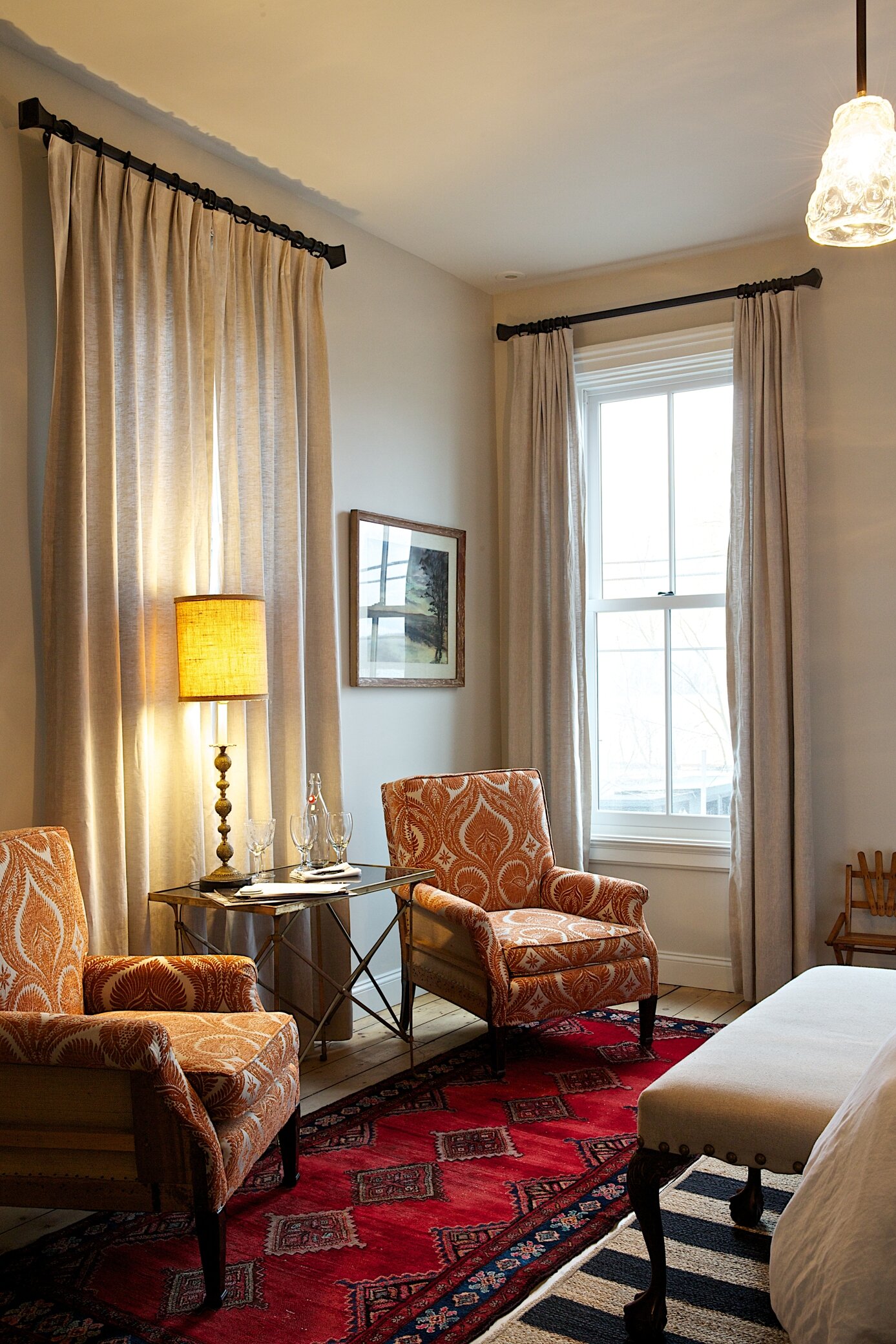 Chairs near a window in a guest room.