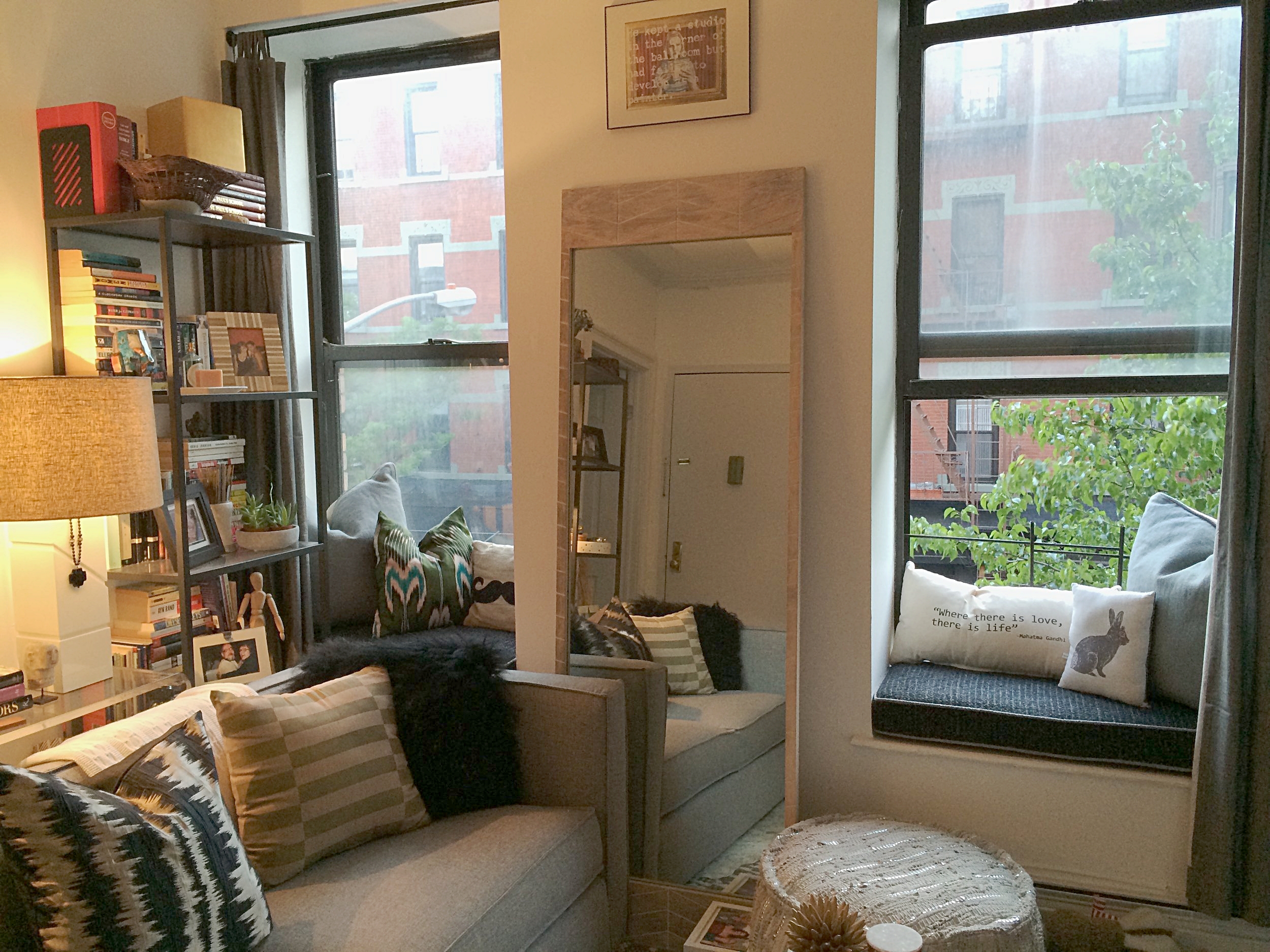 Between the storage under that console on the left, and the extra seating on the window ledges, this tiny Brooklyn apartment was a master-class in Living in Small Spaces and working with what you’ve got!