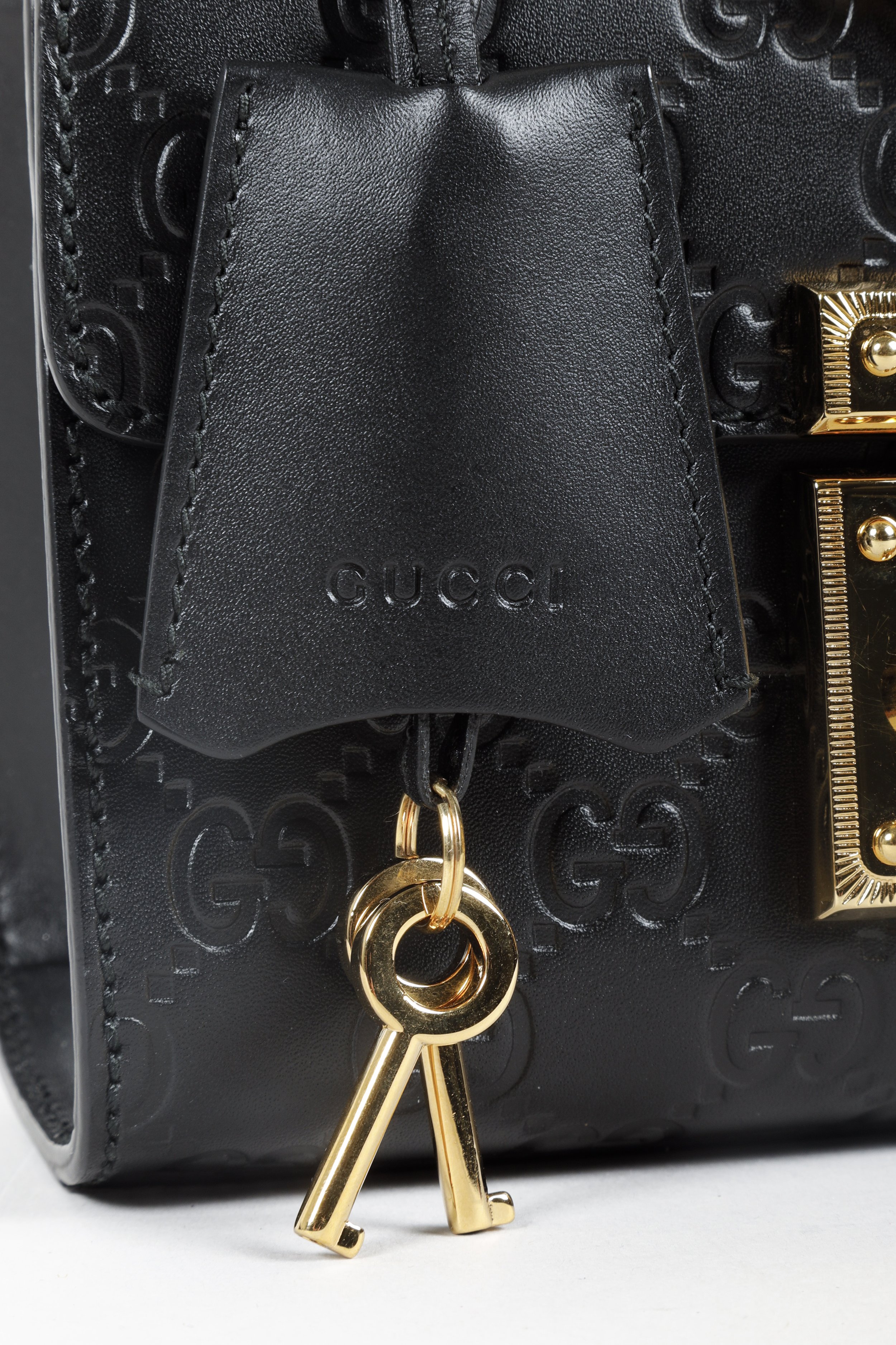 Gucci - Small Debossed GG Leather Shoulder Bag Black | www.luxurybags.eu