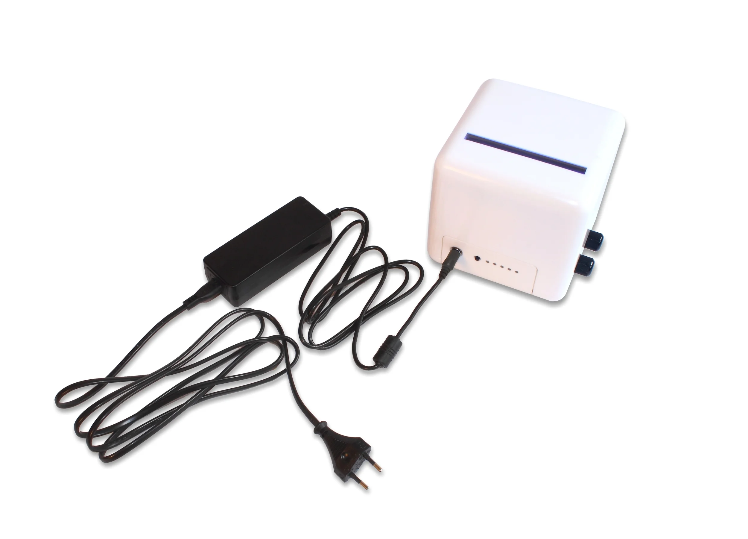 A power supply with European type plug connected to a PrimerCube