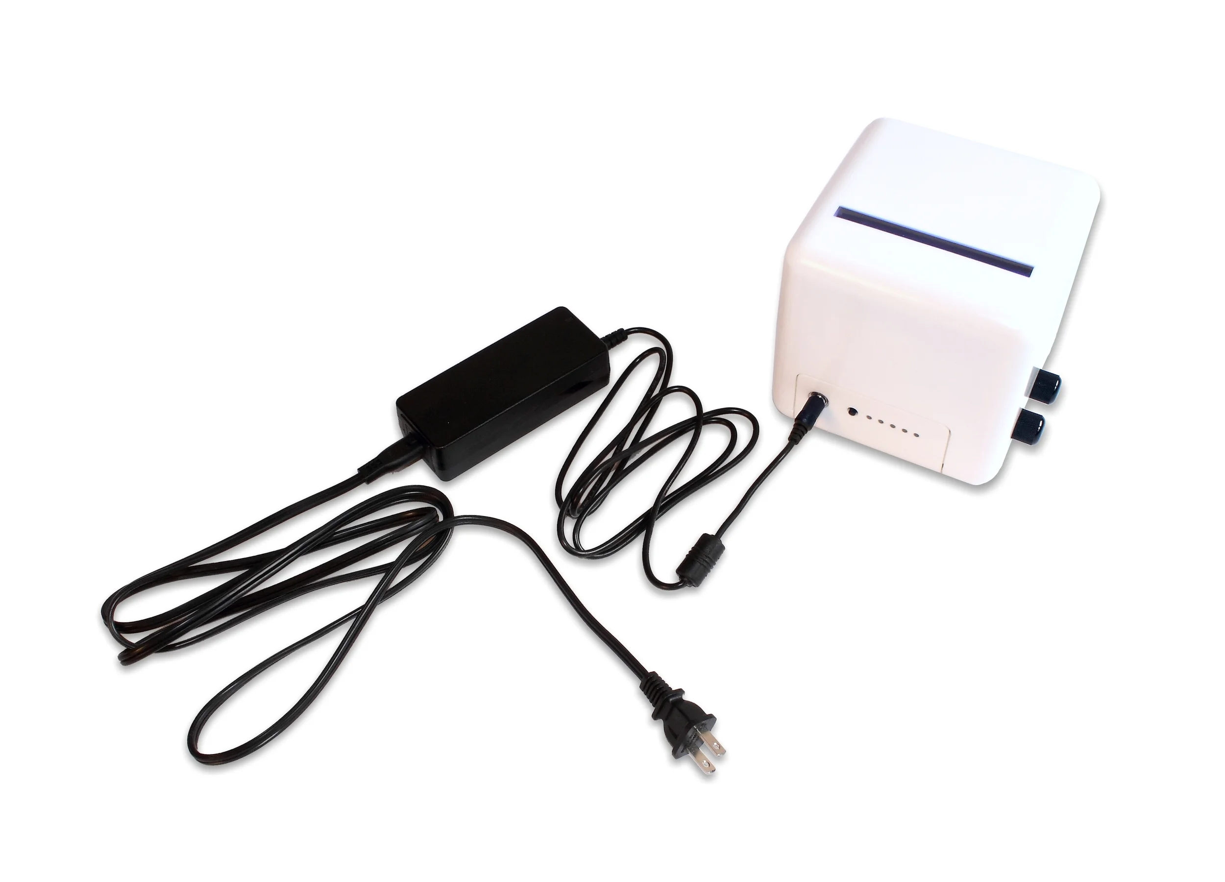 A power supply with US type plug connected to a PrimerCube