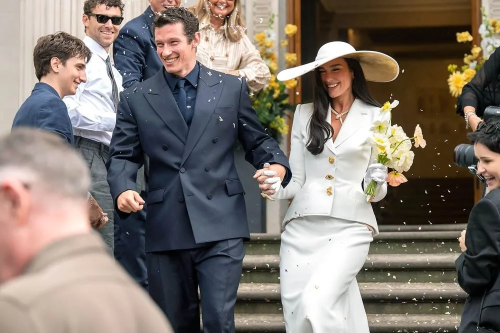 Dua Lipa Channeled Bianca Jagger&rsquo;s Iconic Bridal Look in a Custom Suit for Her Wedding to Callum Turner
Lipa&rsquo;s Schiaparelli bridal ensemble was inspired by Bianca&rsquo;s Yves Saint Laurent skirt suit worn for her wedding to Mick Jagger i