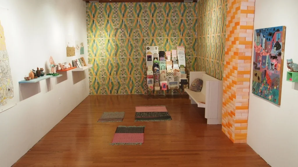 The Reading Nook Curated by Alicia Nauta and Kristin Weckworth As an art form, the book or zine format offers an accessible, tactile and inexpensive way to experience and share visual culture. Handmade book multiples allow artists to experiment and connect on a wider level, both within the artistic community and beyond. The Reading Nook showcases over 40 artists ( artists and more info here ) who create multiples through the medium of books or zines as part of their practice. Narwhal Projects August 2012