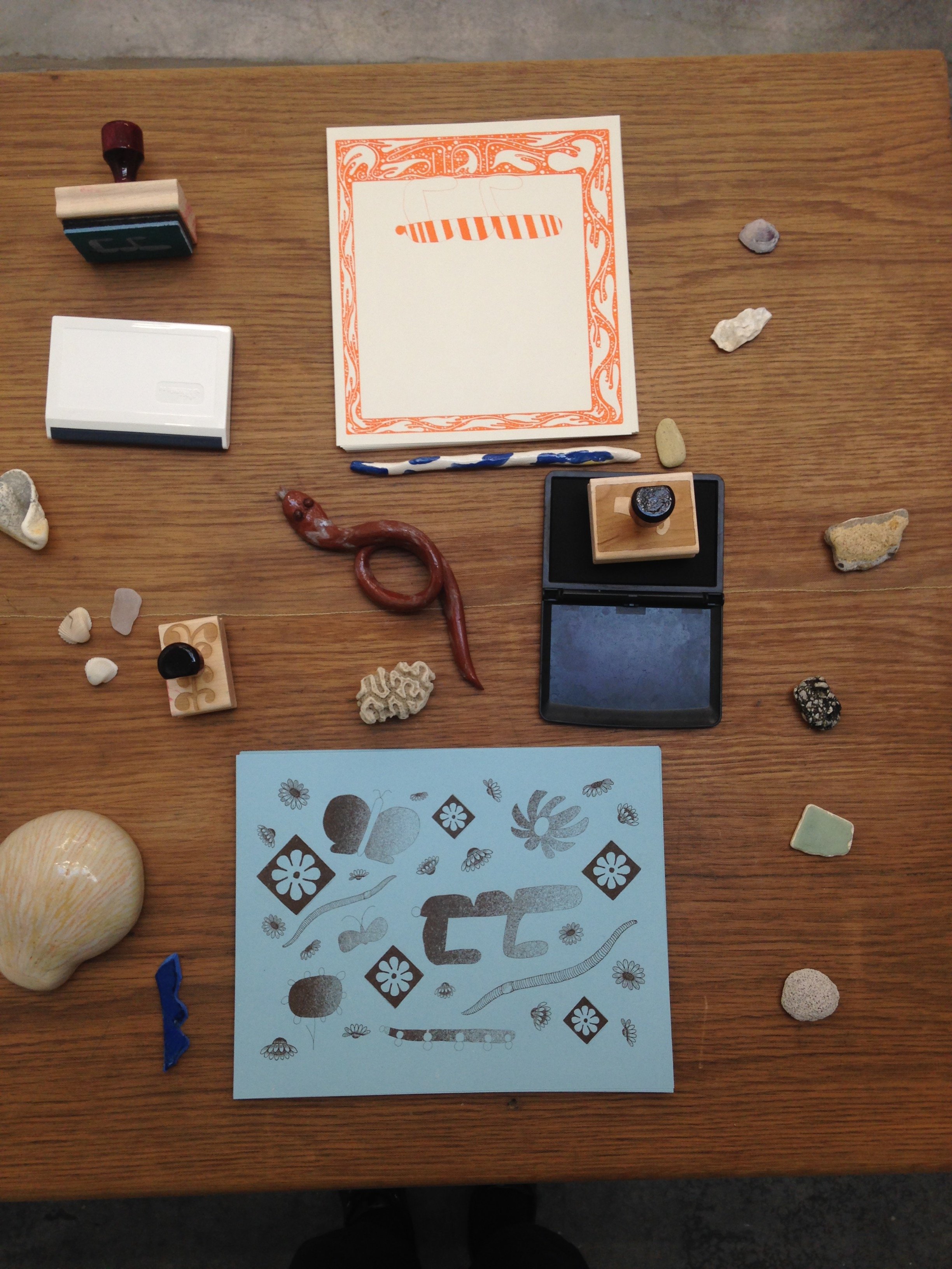  On some faraway beach  Collaboration with Eunice Luk  Screenprinted wallpaper, bugs video installation, rubber stamps, stamp pads, free risograph art prints, ceramics, mesh netting, found stones, vegetation and shells  at Emily Carr University for V