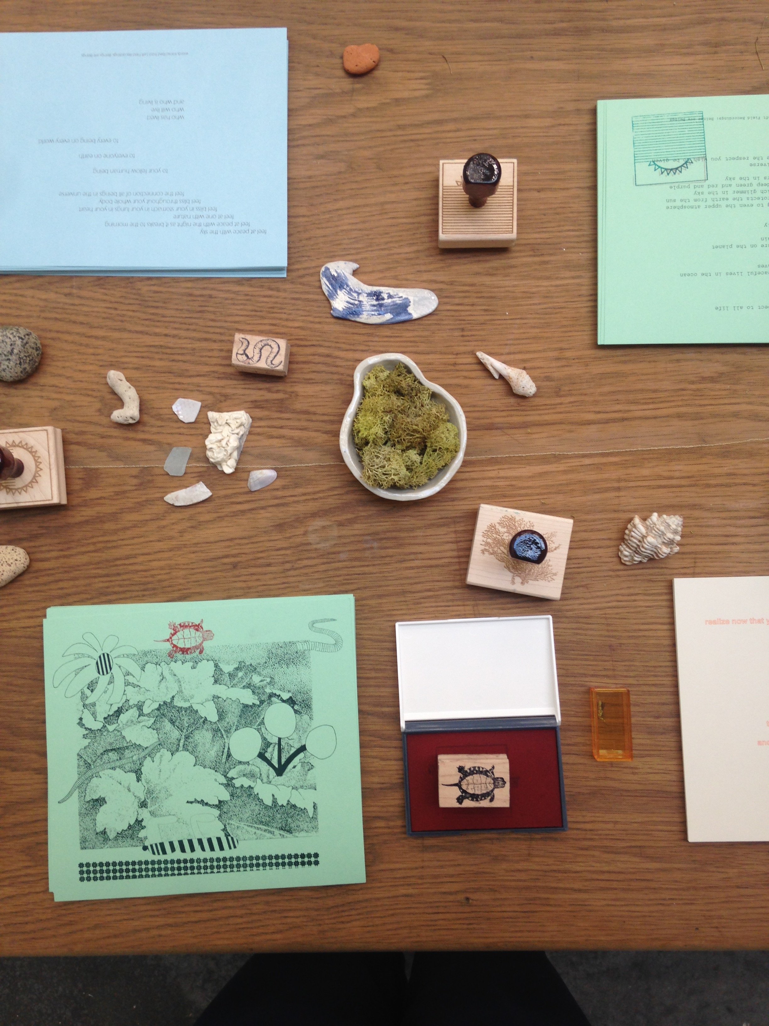  On some faraway beach  Collaboration with Eunice Luk  Screenprinted wallpaper, bugs video installation, rubber stamps, stamp pads, free risograph art prints, ceramics, mesh netting, found stones, vegetation and shells  at Emily Carr University for V