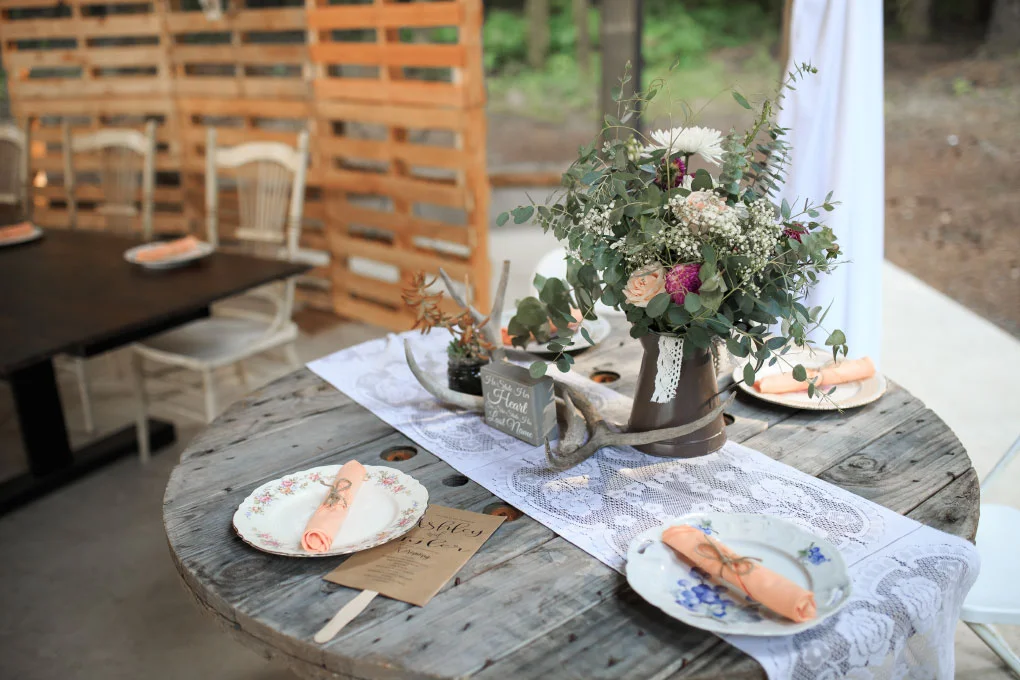 Wedding dinner table decorations at a country wedding.