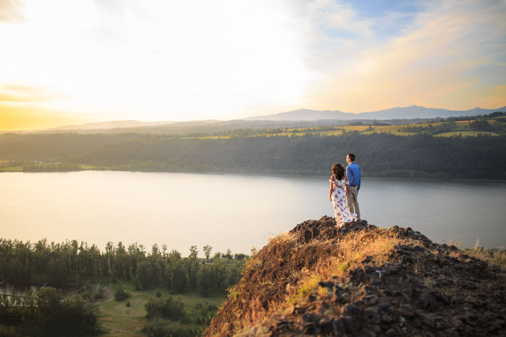 Man and woman looking at Columbia River Gorge sweeping views.