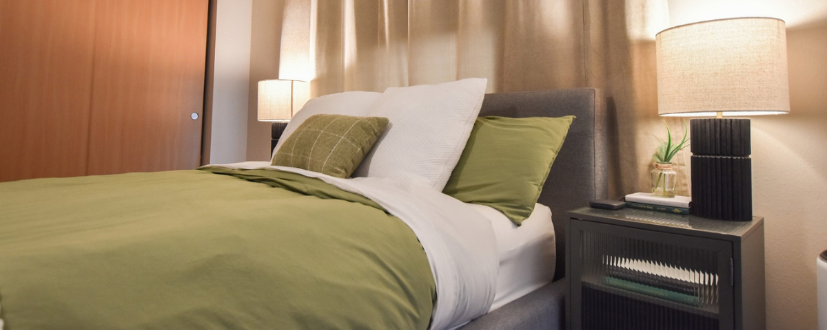 green and white bedsheet layout with a modern bedside table in bremerton, washington
