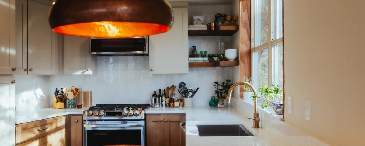 a clean modern kitchen with white countertops, a circular light fixture in bremerton, washington