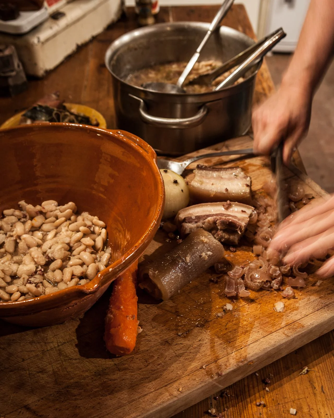 photo: Tim Clinch Kate prepares cassoulet in the Kitchen at Camont .