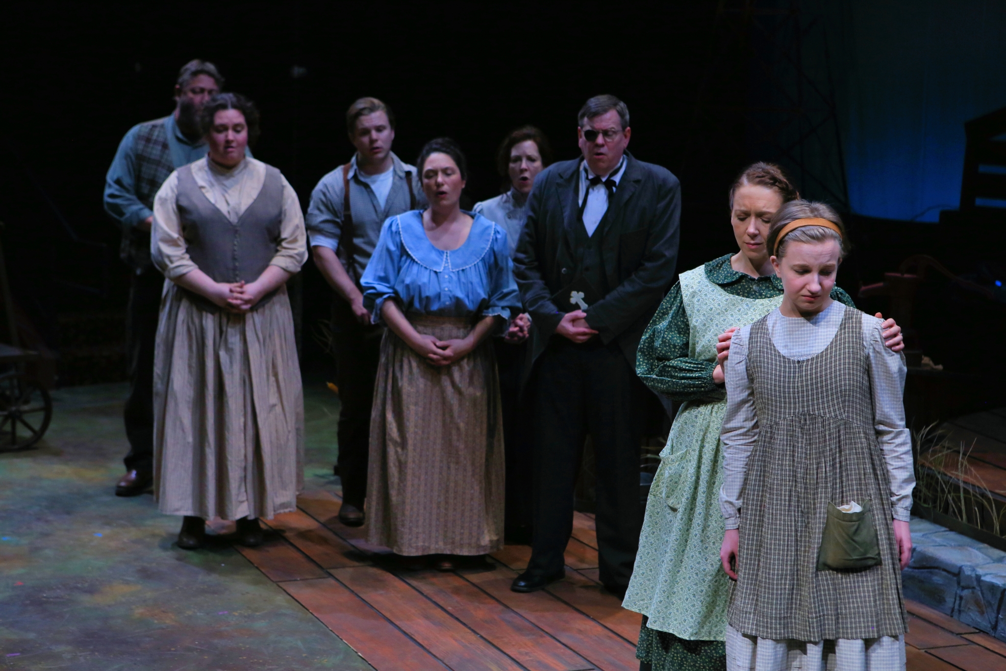 The townsfolk of Gray, Indiana, gather at the funeral of June Muldoon's (Nykeigh Larson, right) father. Rebekah Muldoon (Jessica Scott) does her best to comfort her grief-stricken daughter. Photo credit Scott Pakudaitis.