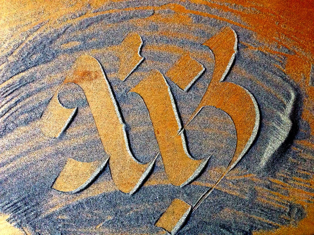 Sand calligraphy on wood.jpg