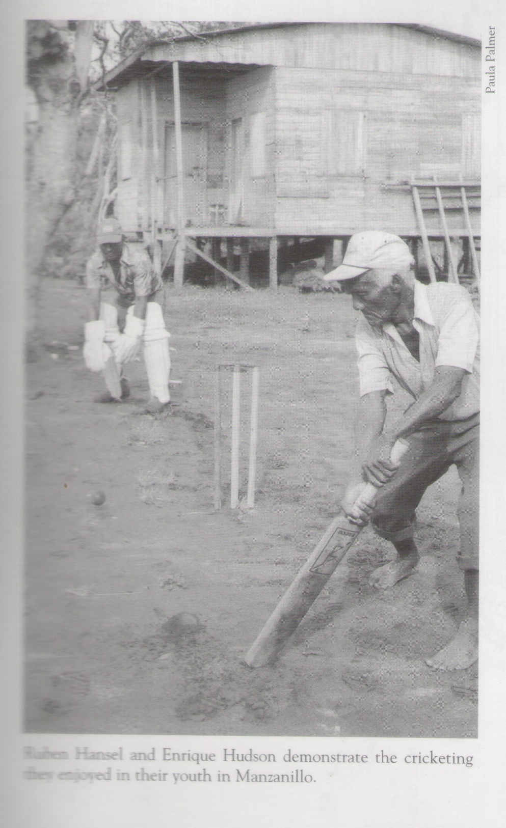 "Ruben Hansel and Enrique Hudson demonstrate the cricketing they enjoyed in their youth in Manzanillo." Source: "What Happen" by Paula Palmer, p.95 (2005 edition)